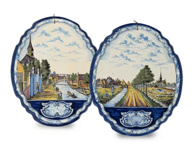 A PAIR OF DUTCH DELFT POLYCHROME SHAPED OVAL PLAQUES, LATE 19TH OR
