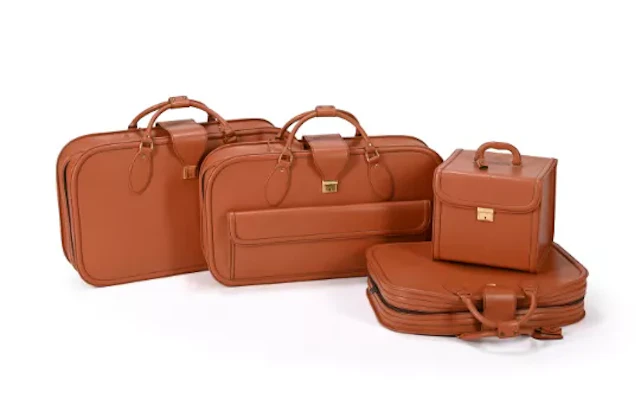 SCHEDONI FOR FERRARI , A FOUR PIECE TAN LEATHER LUGGAGE SET