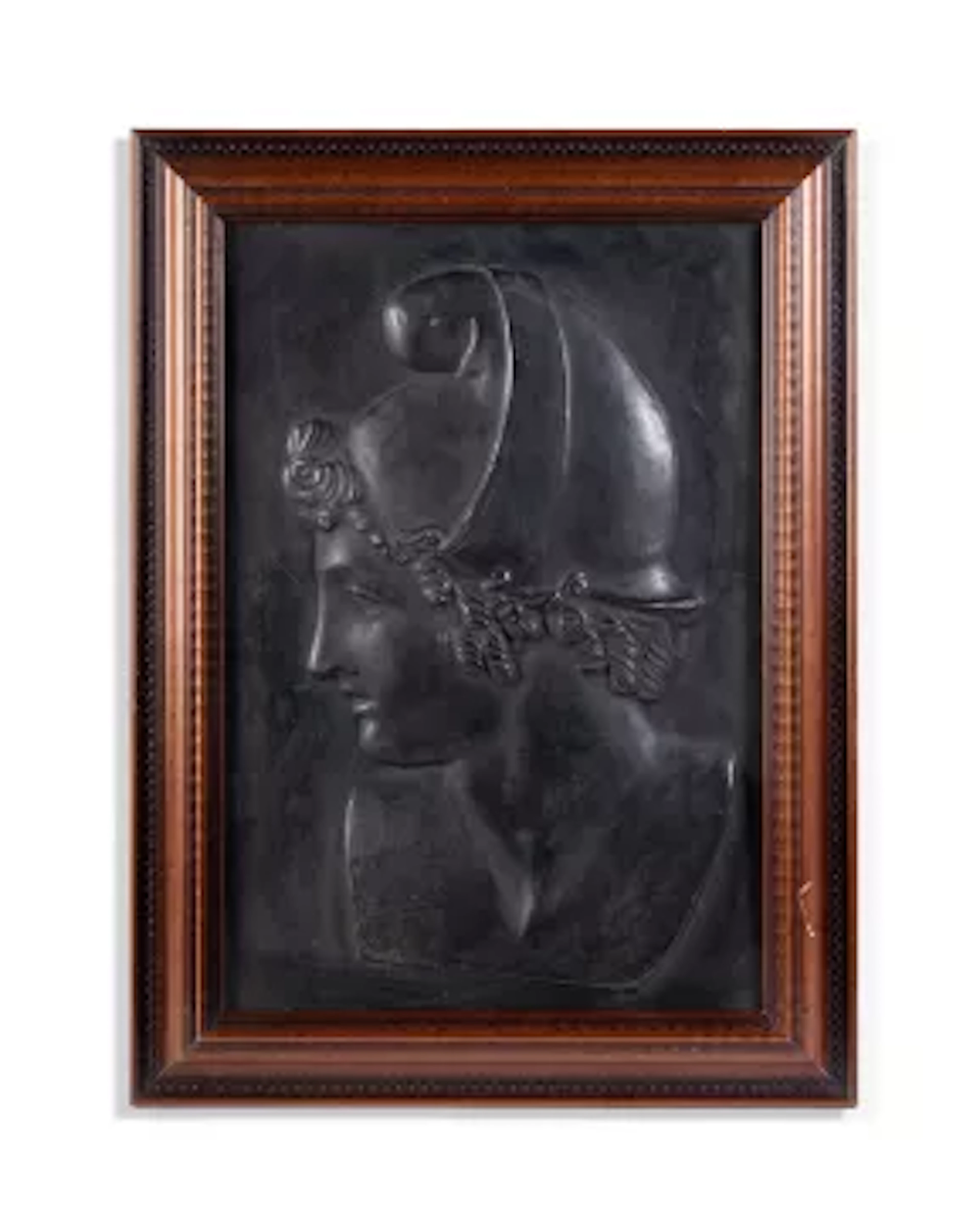 A BLACK PAINTED COMPOSITION RELIEF OF A MAN, 20TH CENTURY