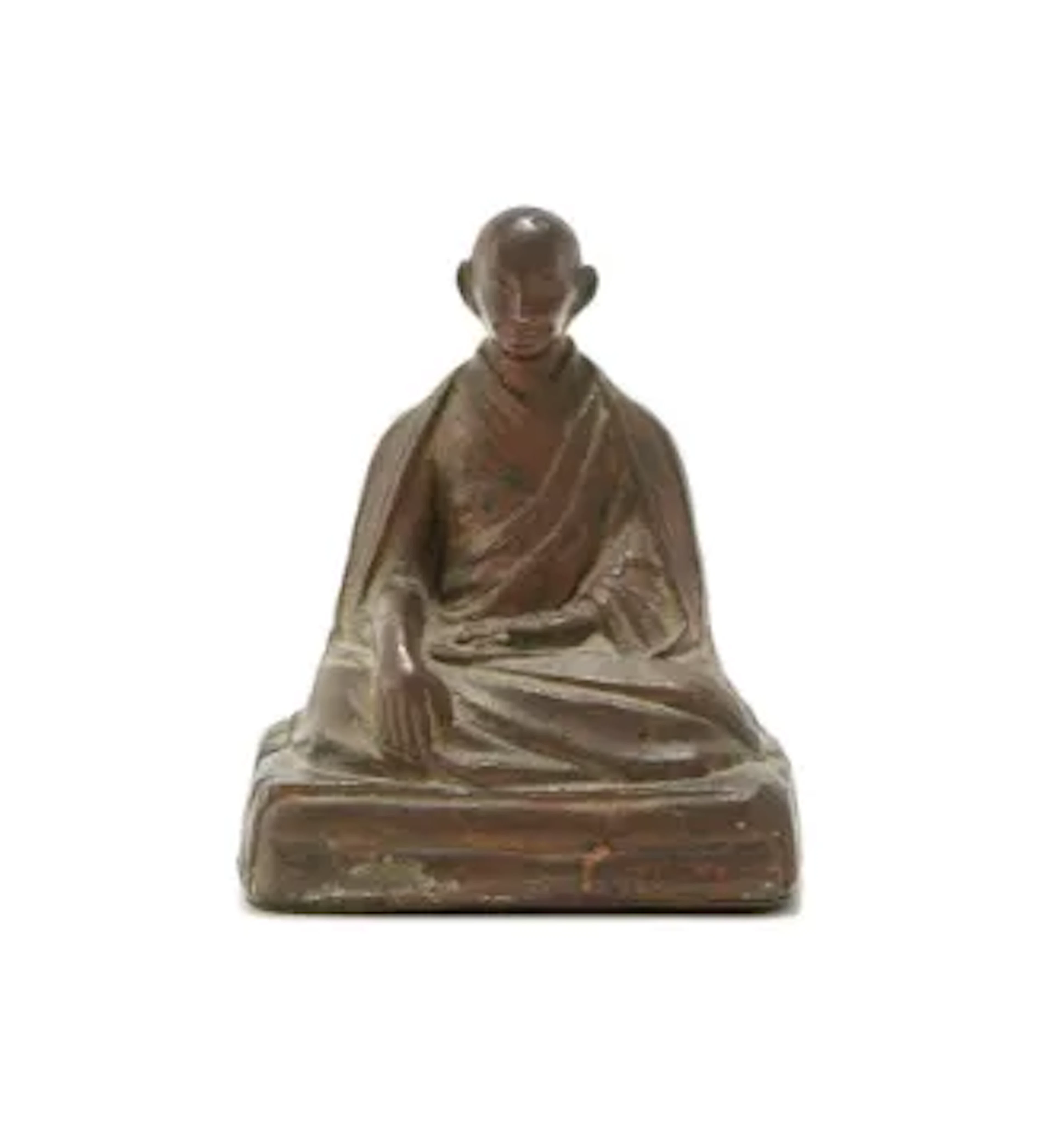A Tibetan bronze figure of a Lama, 17th or 18th century