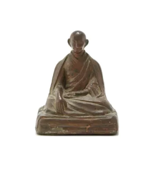 A Tibetan bronze figure of a Lama, 17th or 18th century