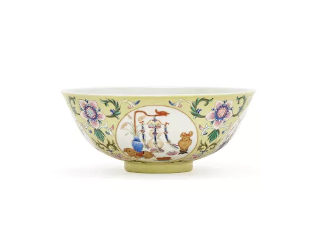 A Chinese yellow ground famille rose sgraffiato medallions bowl