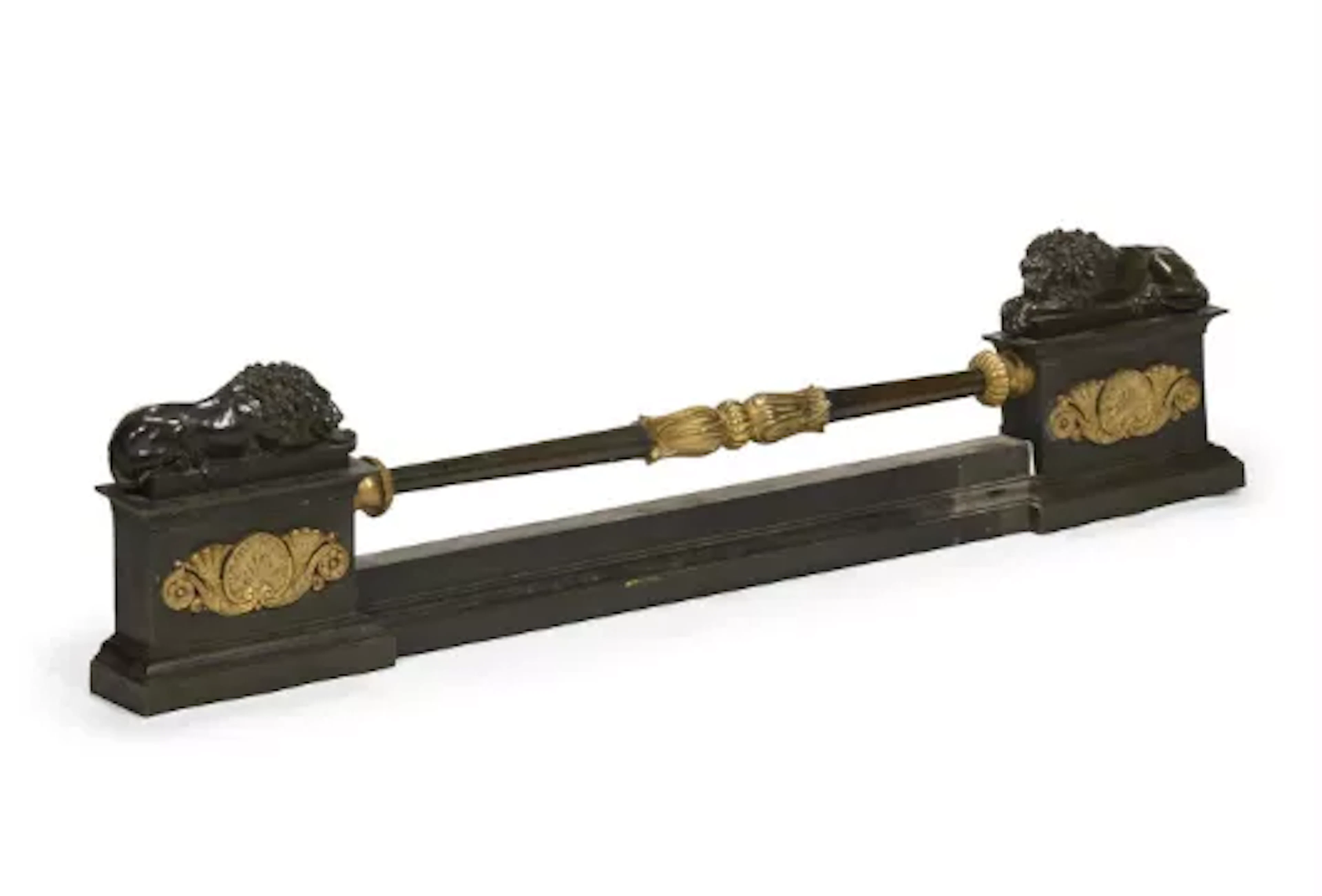 A REGENCY GILT AND PATINATED BRONZE AND IRON FIRE OR KERB FENDER