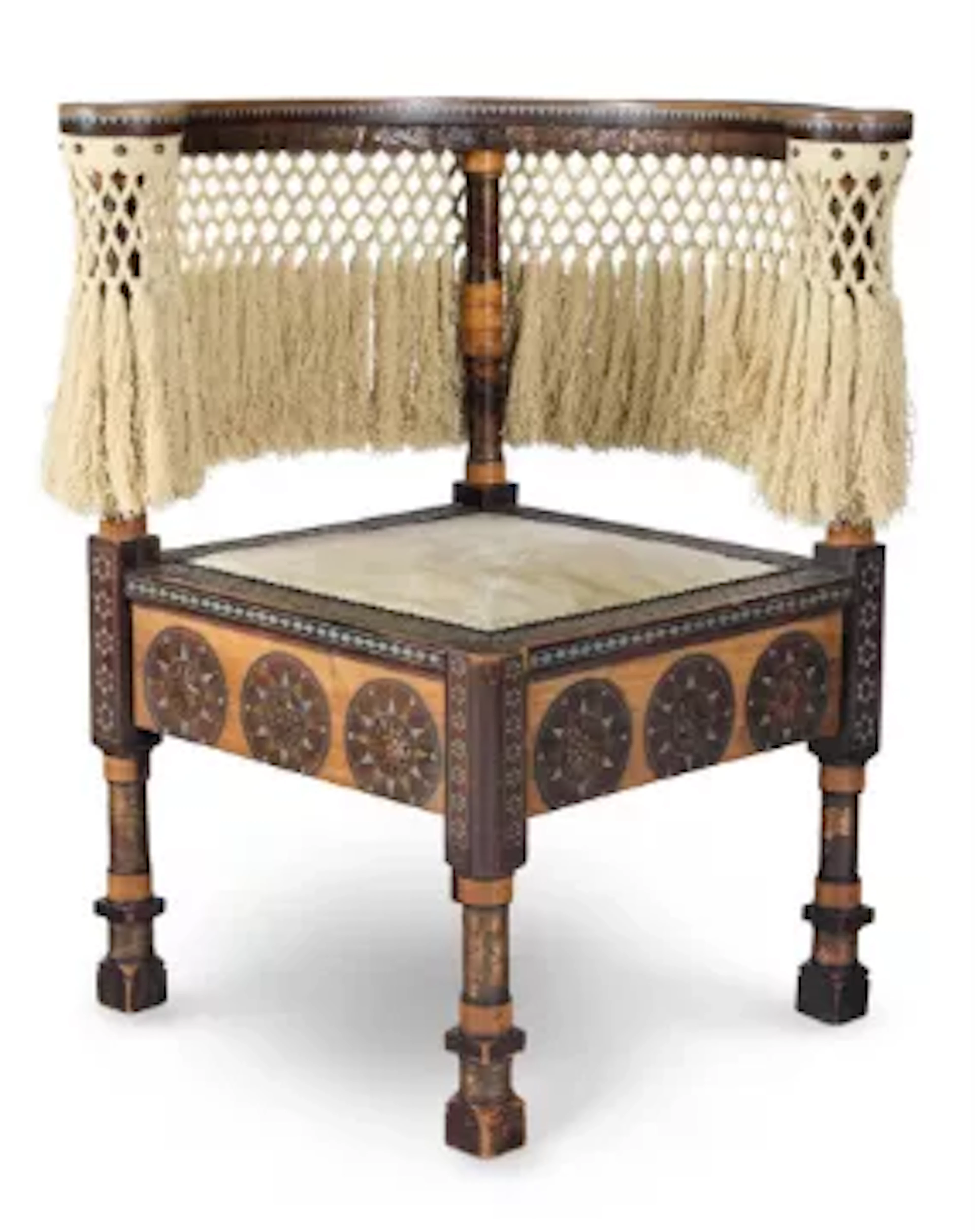 A CORNER CHAIR WITH BRASS AND PEWTER INLAY, CARVED AND REPOUSSÉ DECORATION