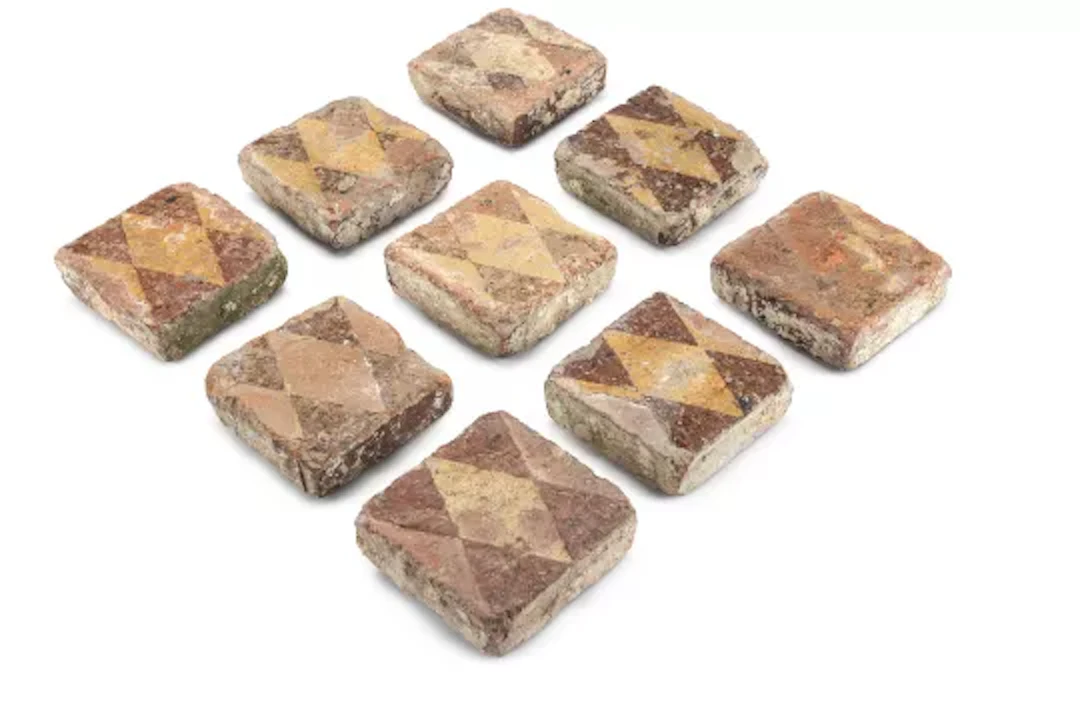 A SET OF NINE ENCAUSTIC TILES, PROBABLY 14TH CENTURY