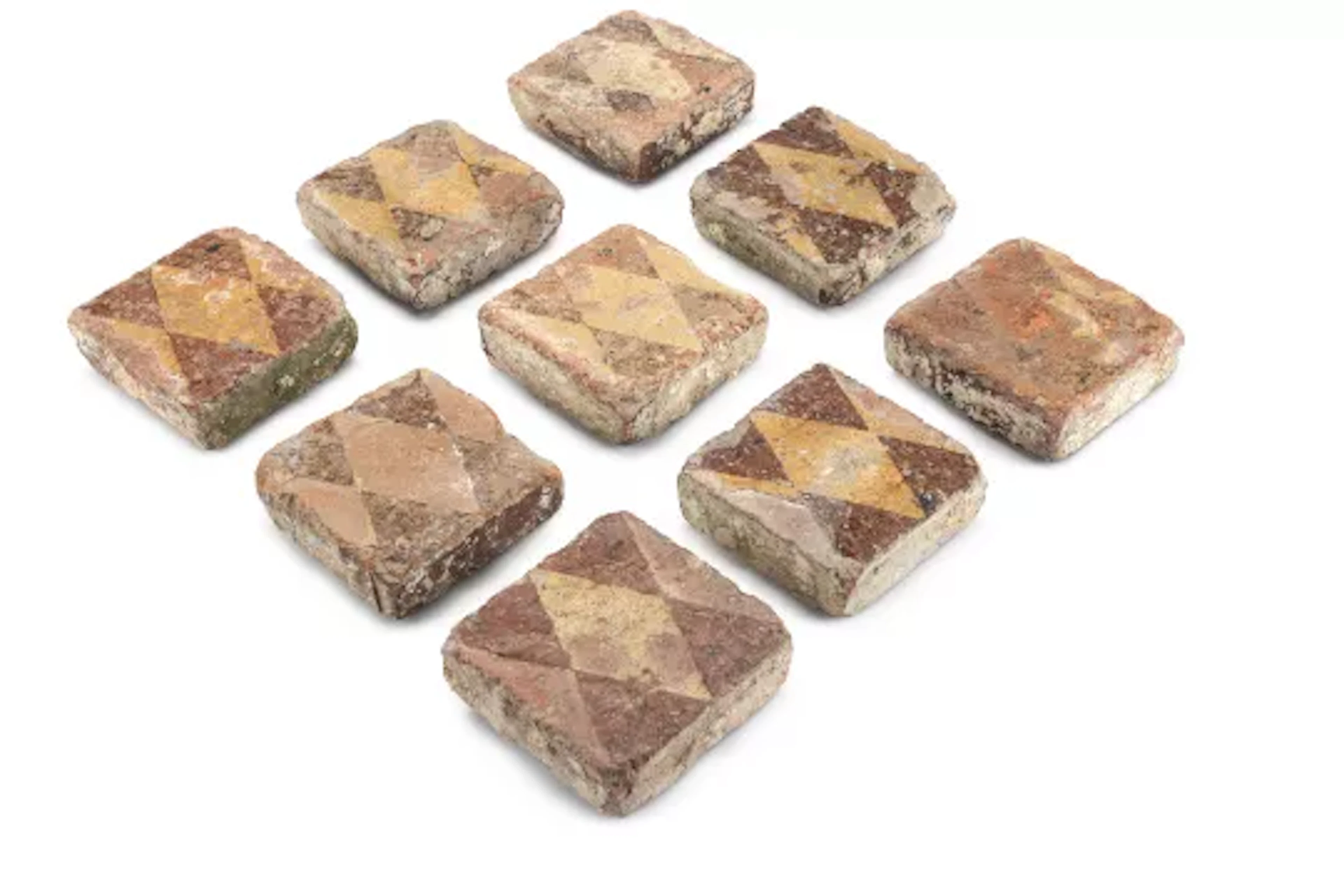 A SET OF NINE ENCAUSTIC TILES, PROBABLY 14TH CENTURY