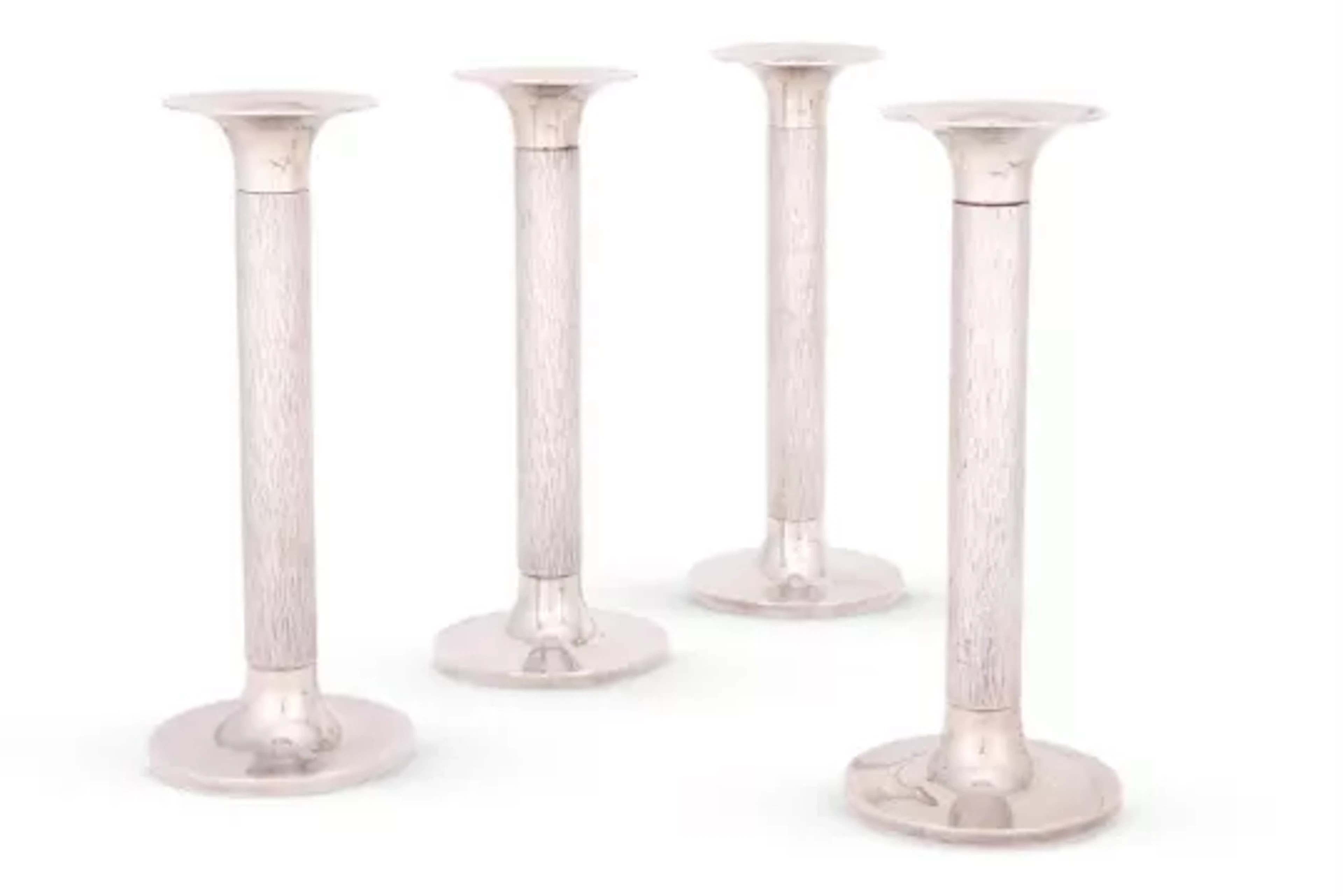 GERALD BENNEY (1930-2008), A SET OF FOUR SILVER CANDLESTICKS