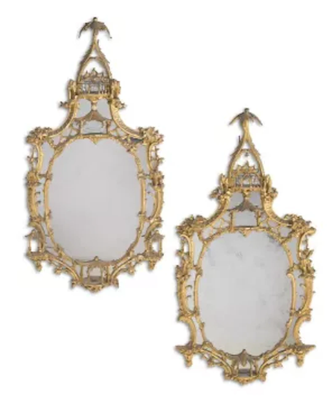 A LARGE PAIR OF CARVED GILTWOOD MIRRORS, IN THE MANNER OF THOMAS CHIPPENDALE