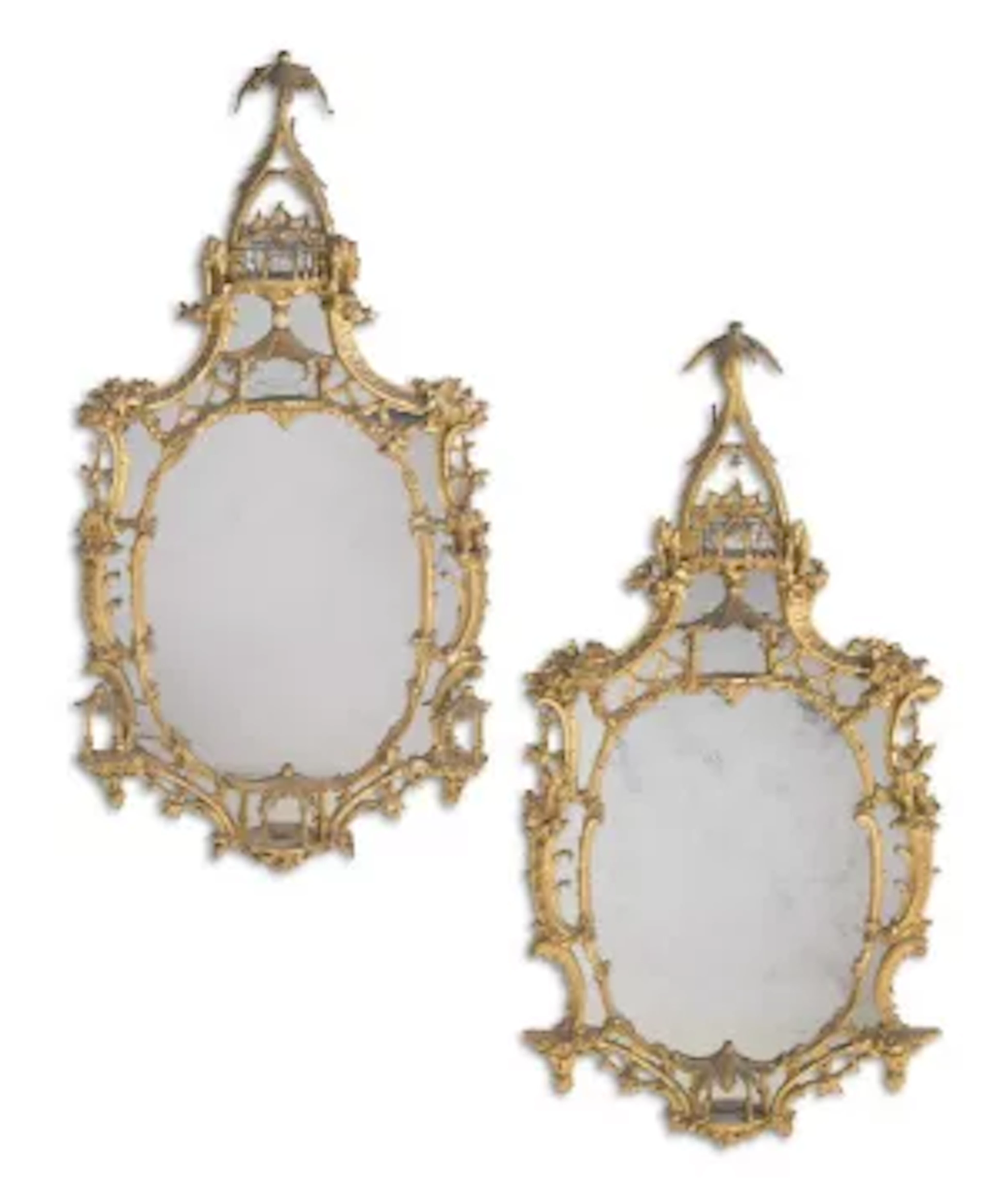 A LARGE PAIR OF CARVED GILTWOOD MIRRORS, IN THE MANNER OF THOMAS CHIPPENDALE