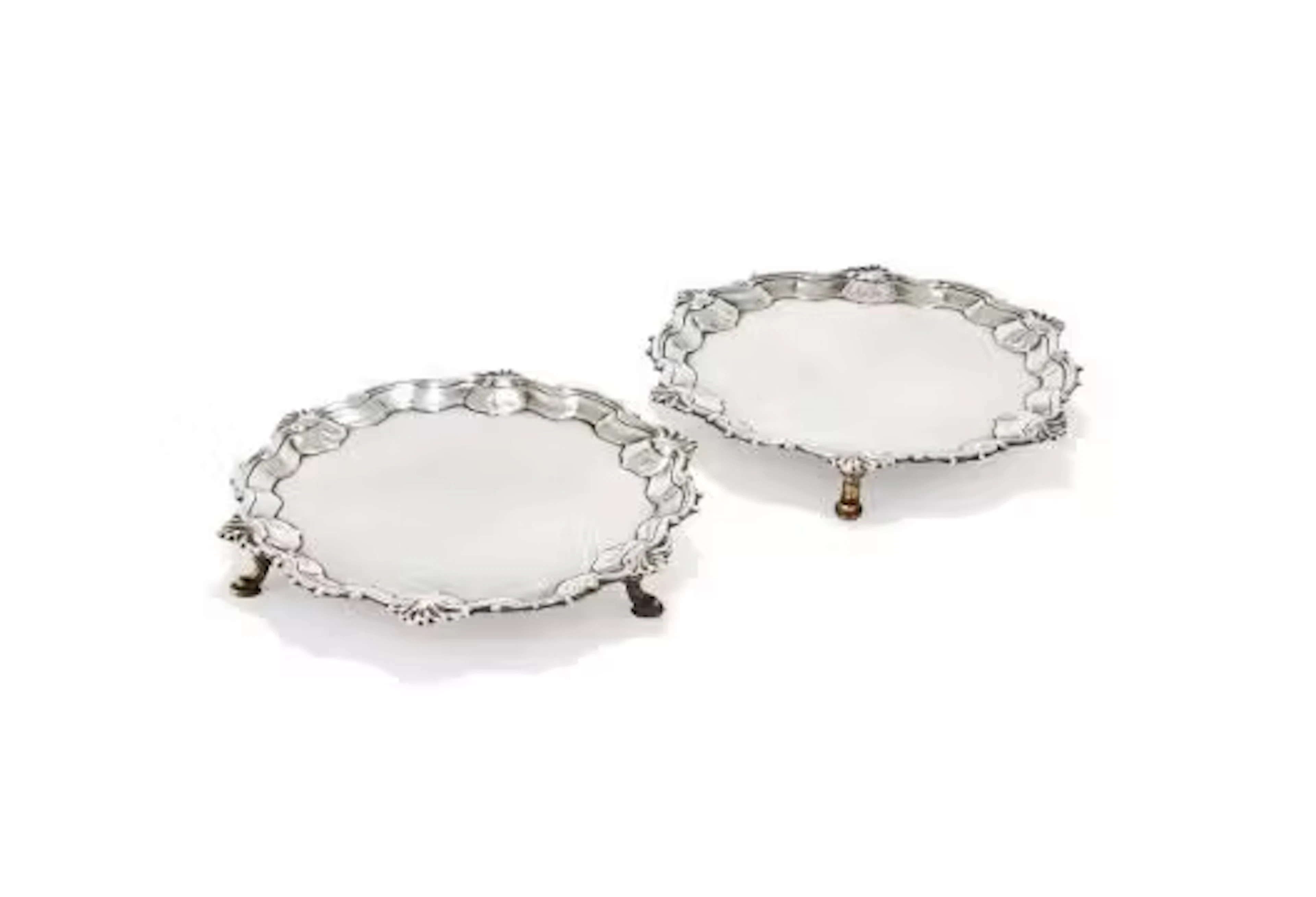 A PAIR OF GEORGE III SILVER SHAPED CIRCULAR WAITERS