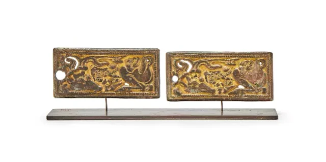 A pair of Chinese gilt bronze belt plaques, North China, 3rd-2nd century BC
