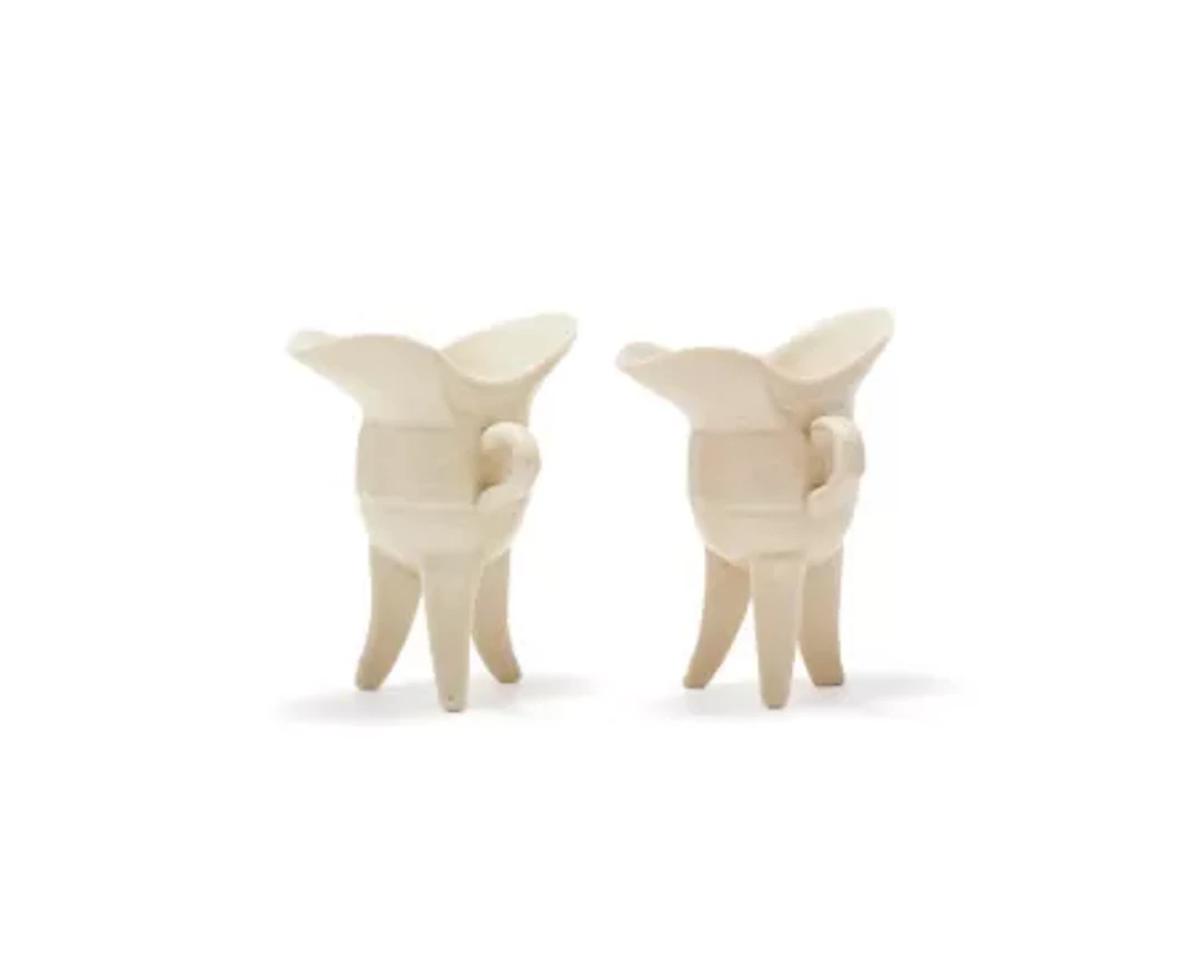 A pair of Chinese Dehua tripod 'jue' libation cups, Kangxi (1662-1722)