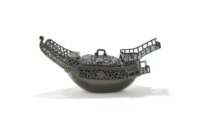 A Chinese bronze boat form incense burner and cover, 17th or 18th century