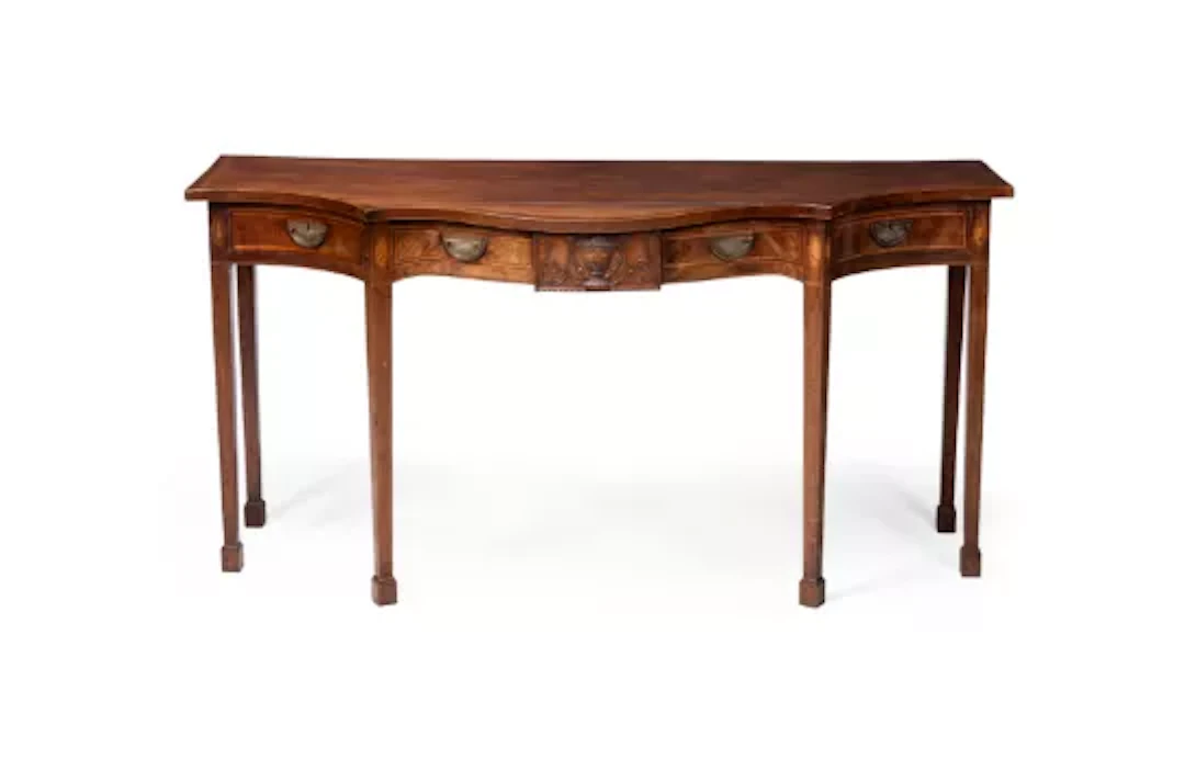 A FINE GEORGE III CARVED MAHOGANY AND INLAID SERPENTINE SERVING TABLE