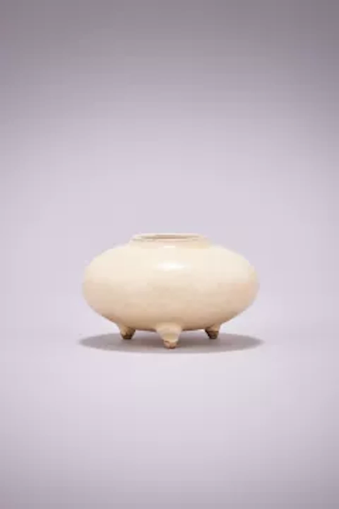 A Chinese Cizhou white glazed tripod water pot, Yuan Dynasty (1271-1368)
