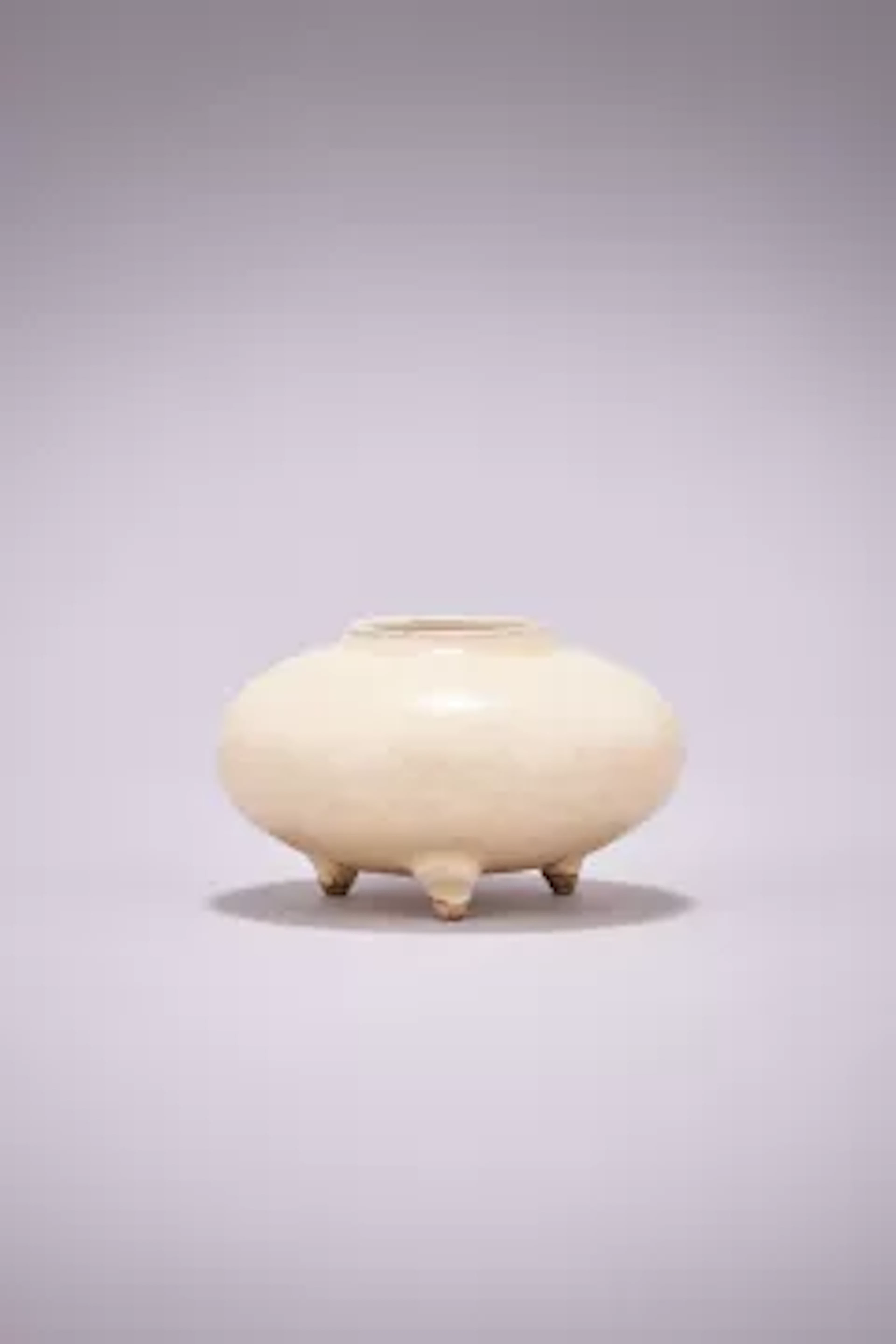 A Chinese Cizhou white glazed tripod water pot, Yuan Dynasty (1271-1368)