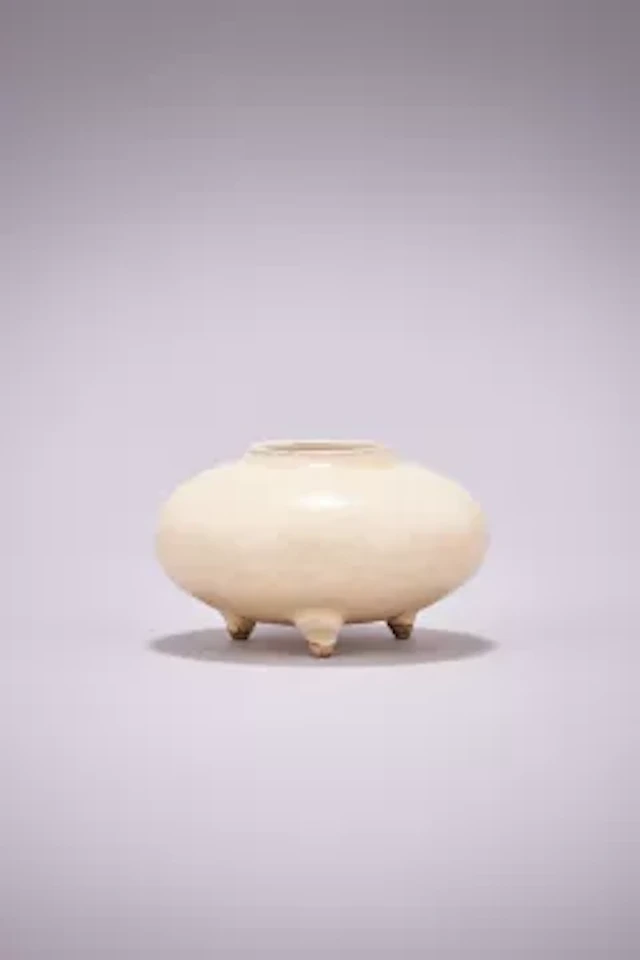 A Chinese Cizhou white glazed tripod water pot, Yuan Dynasty (1271-1368)