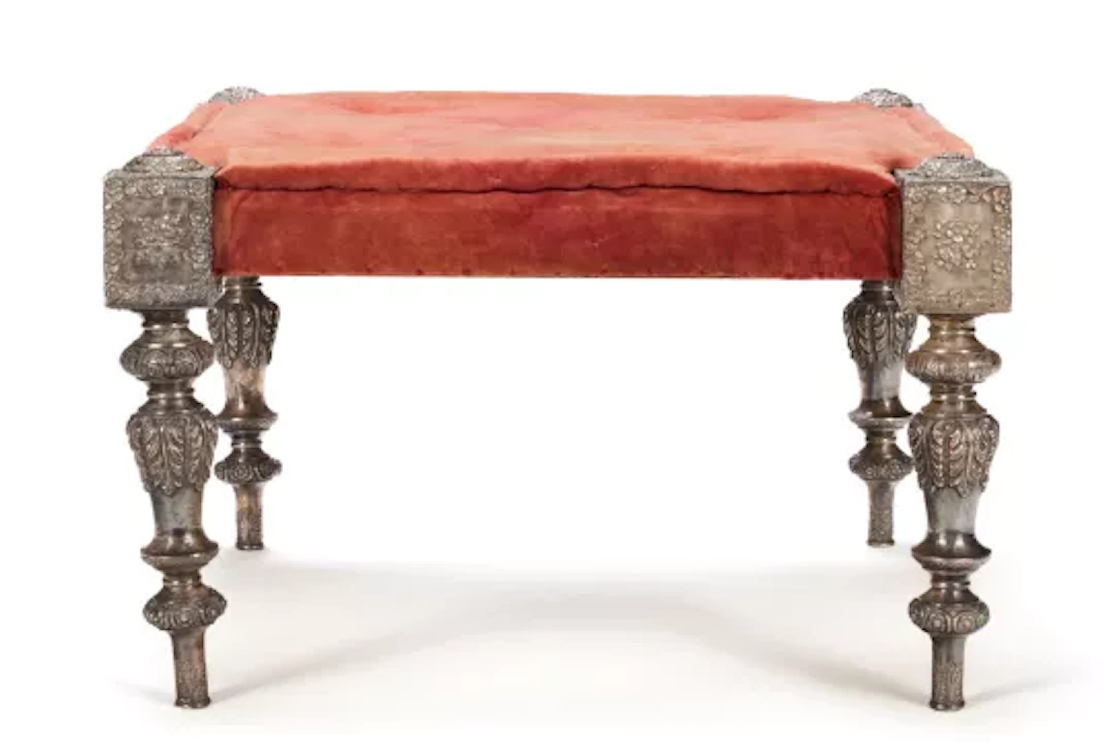 A RAJASTHANI RED VELVET UPHOLSTERED SILVER 'PALACE' STOOL OF LARGE SIZE