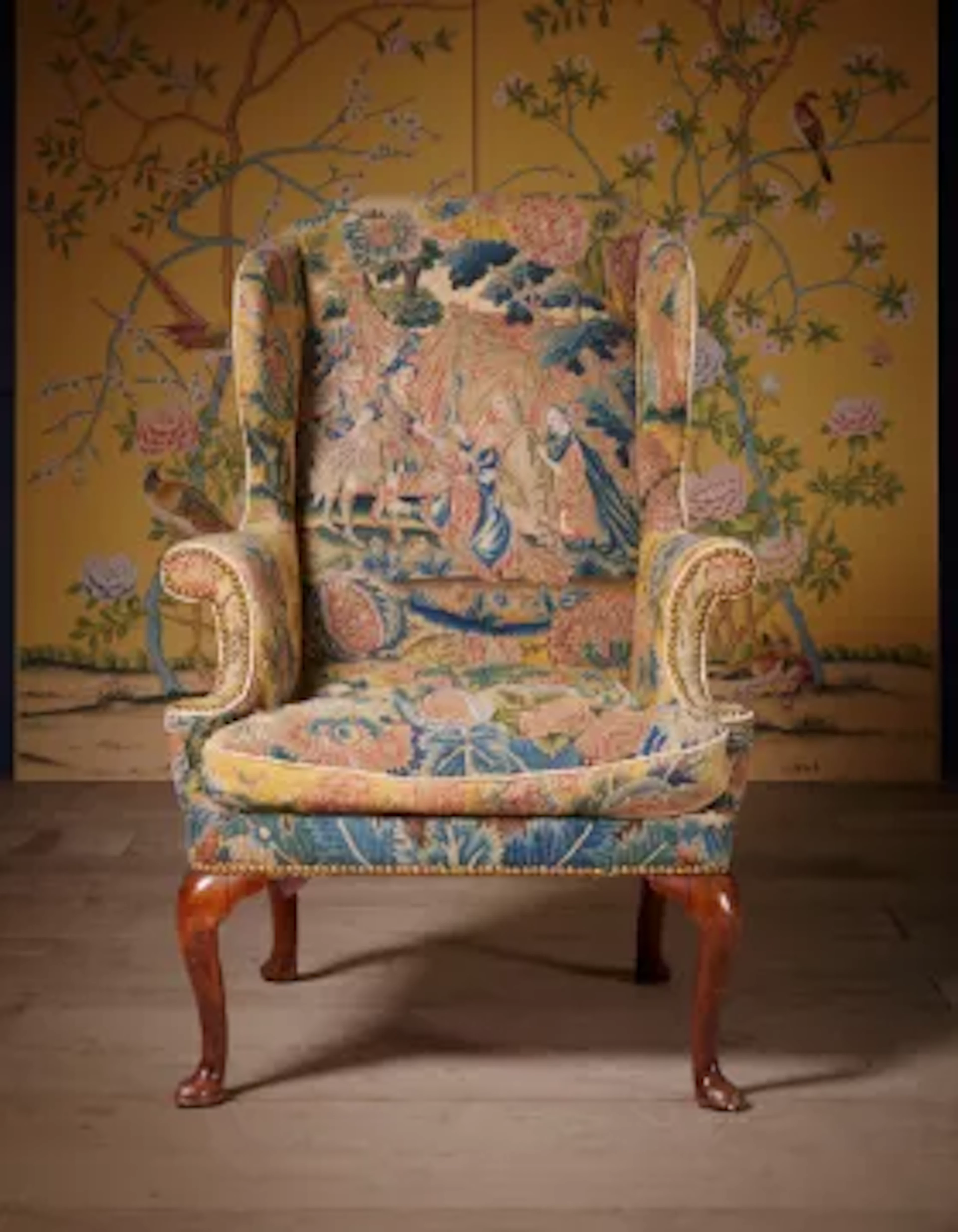 A GEORGE I WALNUT AND NEEDLEWORK WING ARMCHAIR, CIRCA 1720