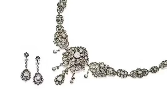 A. J ROUS, A DIAMOND NECKLACE AND EARRINGS