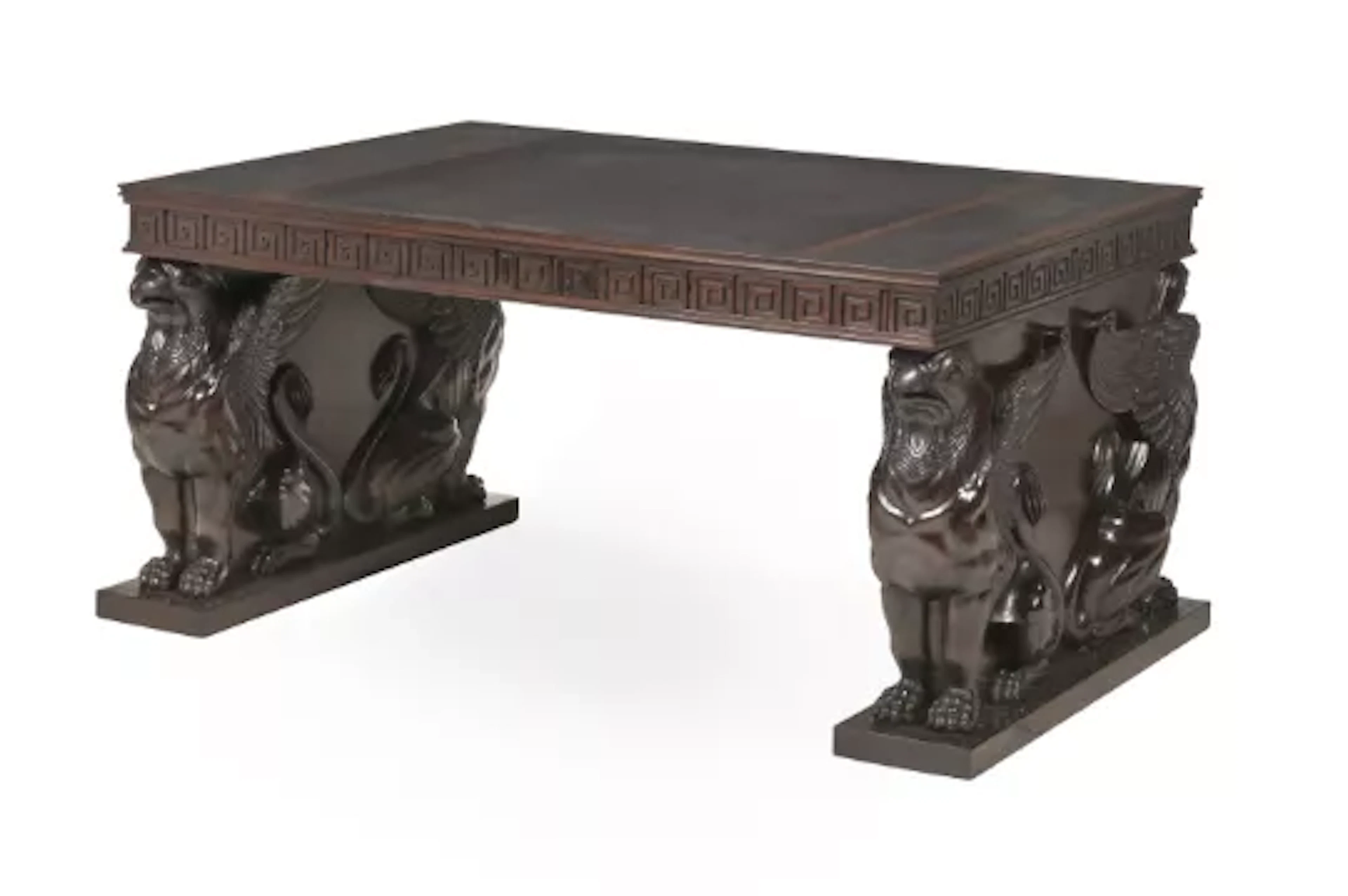 A CARVED MAHOGANY AND LEATHER INSET PEDESTAL DESK, IN REGENCY STYLE
