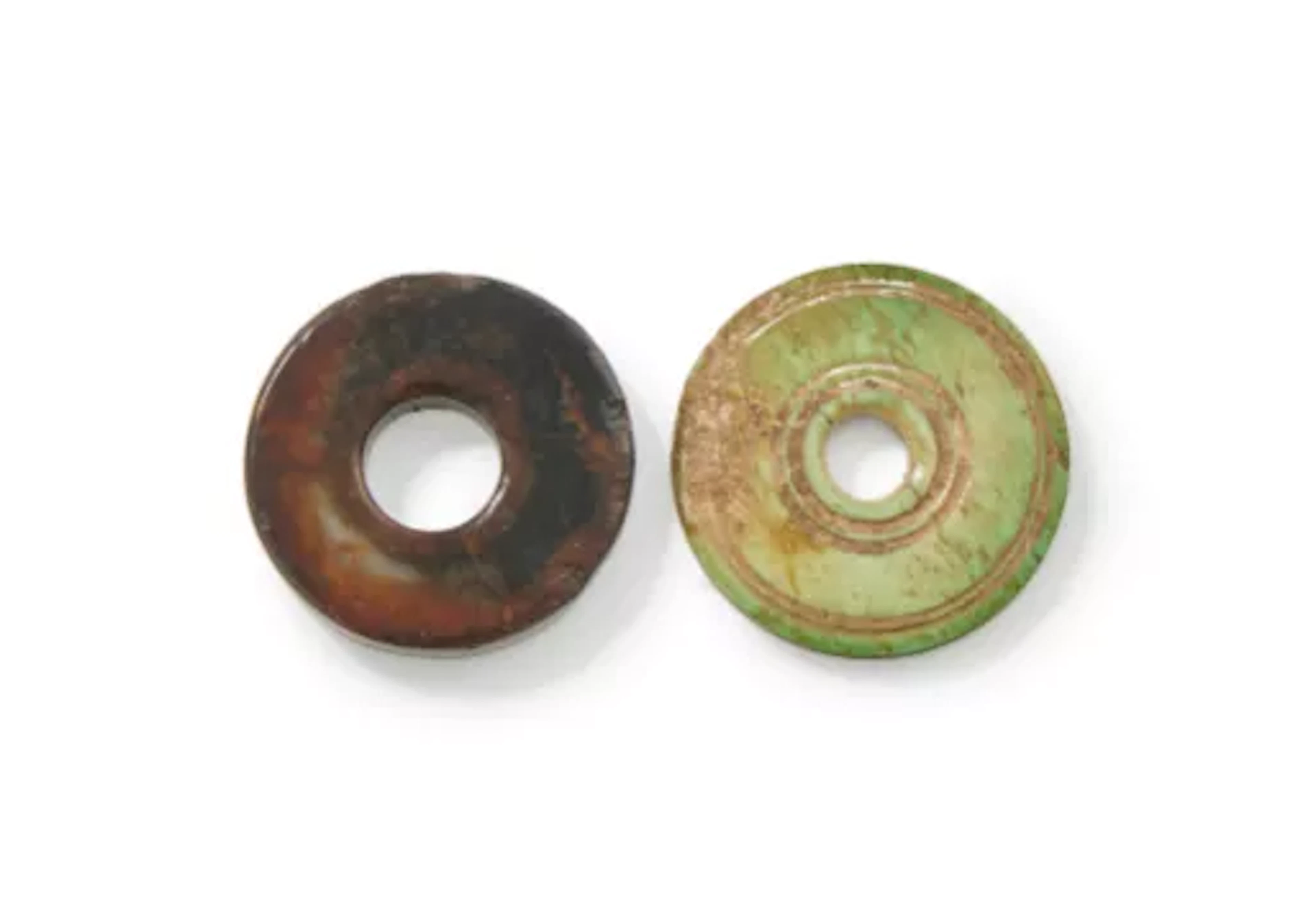 A small Chinese brown and russet jade Bi disc, Ming Dynasty
