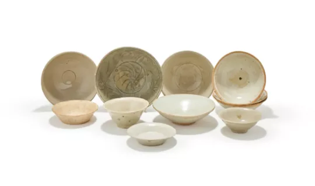 A group of eleven various Chinese white and celadon glazed bowls