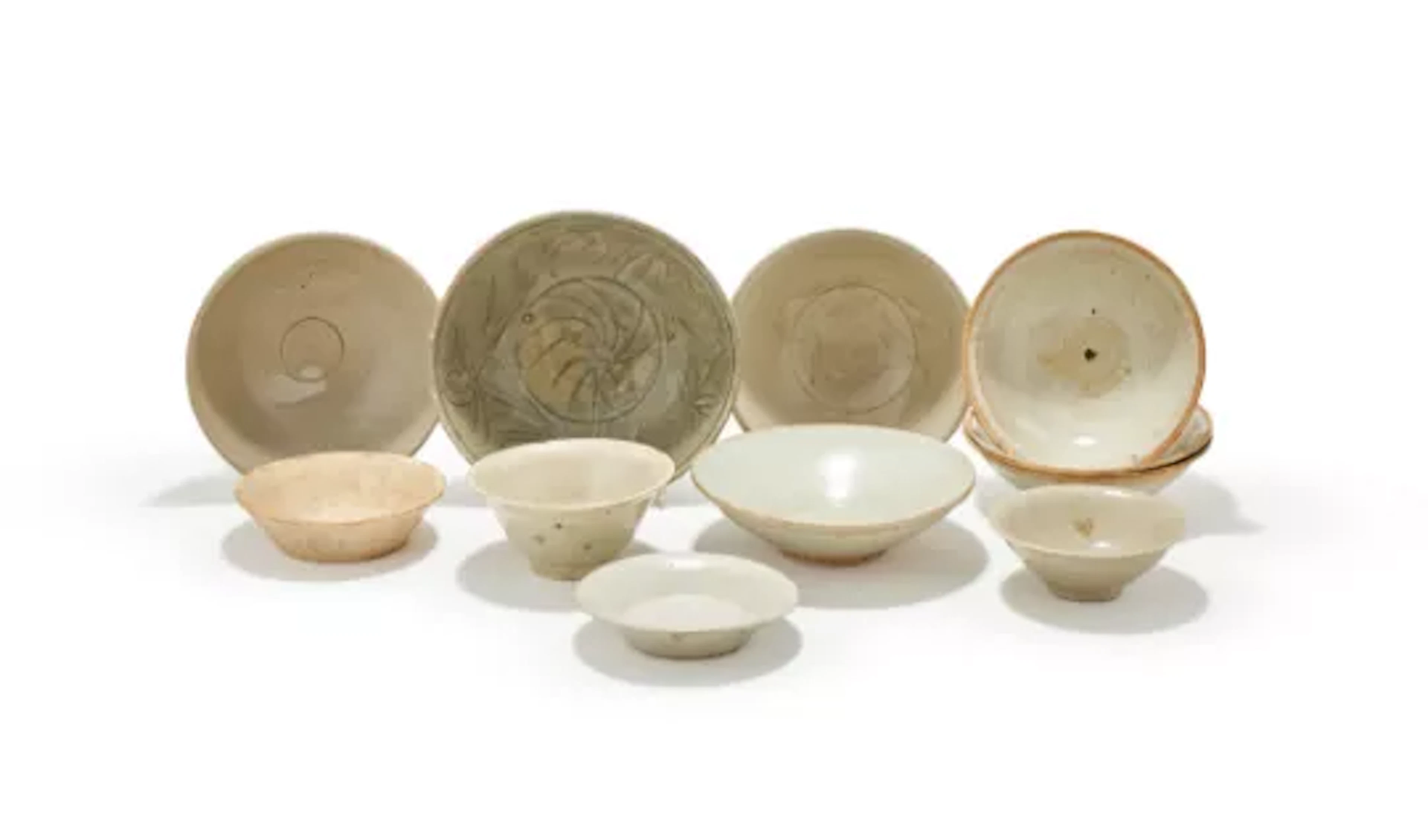 A group of eleven various Chinese white and celadon glazed bowls