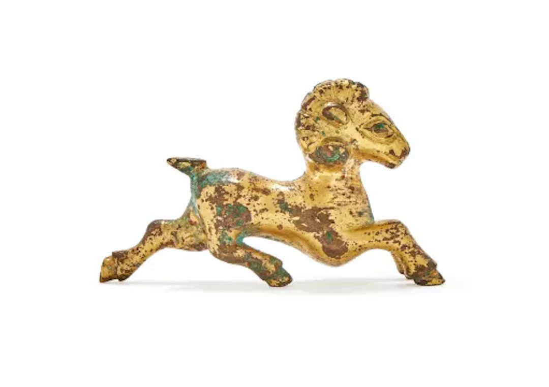 A small Chinese gilt bronze model of a ram, Possibly 3rd-1st century BC