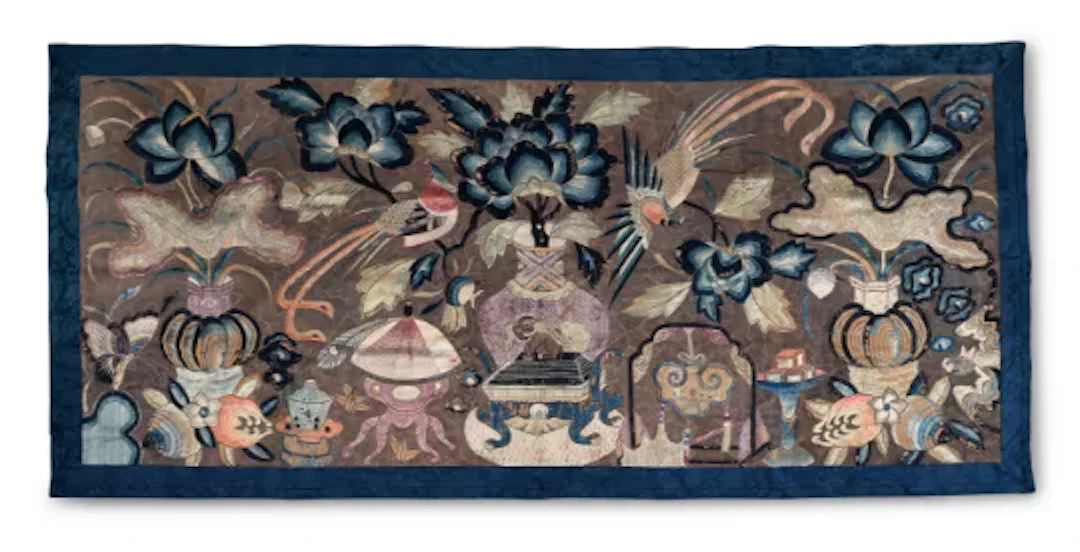 A Chinese large embroidered panel with a silver geometric couched thread ground