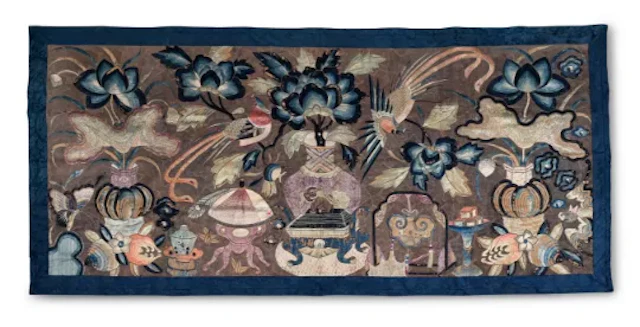 A Chinese large embroidered panel with a silver geometric couched thread ground