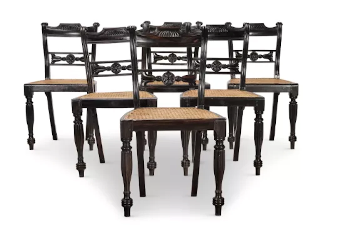 Y‡ A SET OF SIX EBONY AND CANED DINING CHAIRS, INDIAN, SECOND HALF