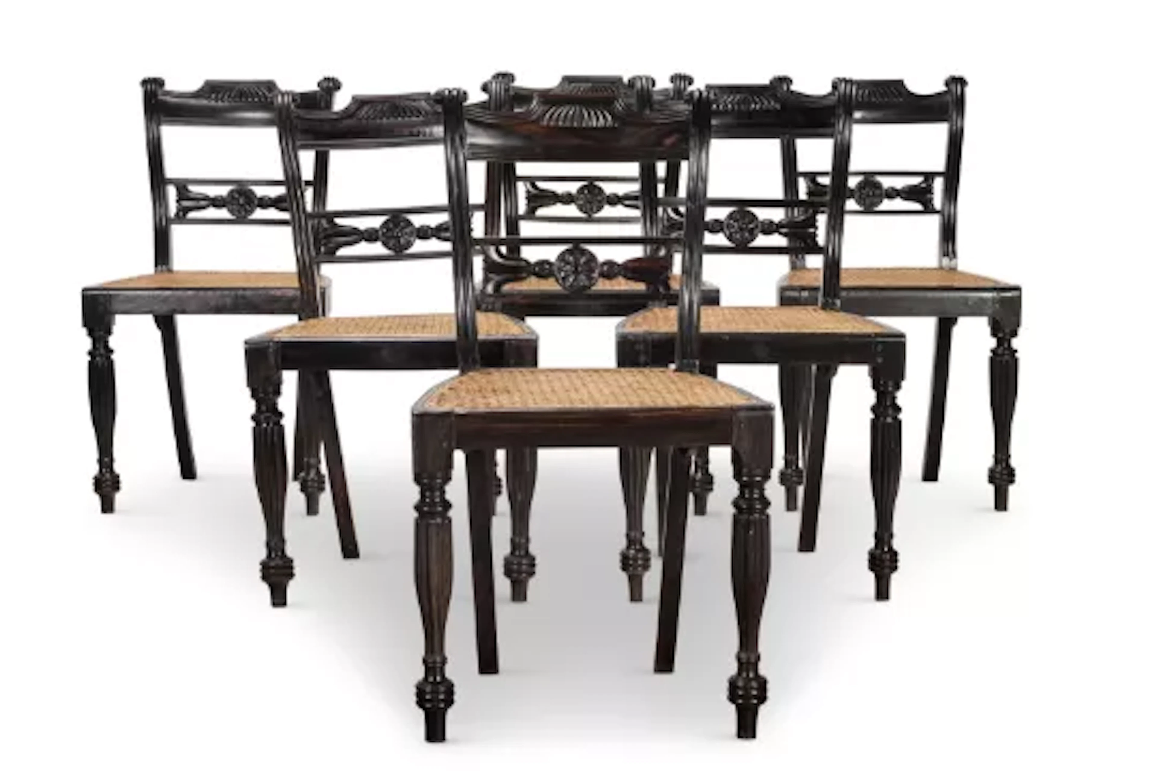 Y‡ A SET OF SIX EBONY AND CANED DINING CHAIRS, INDIAN, SECOND HALF