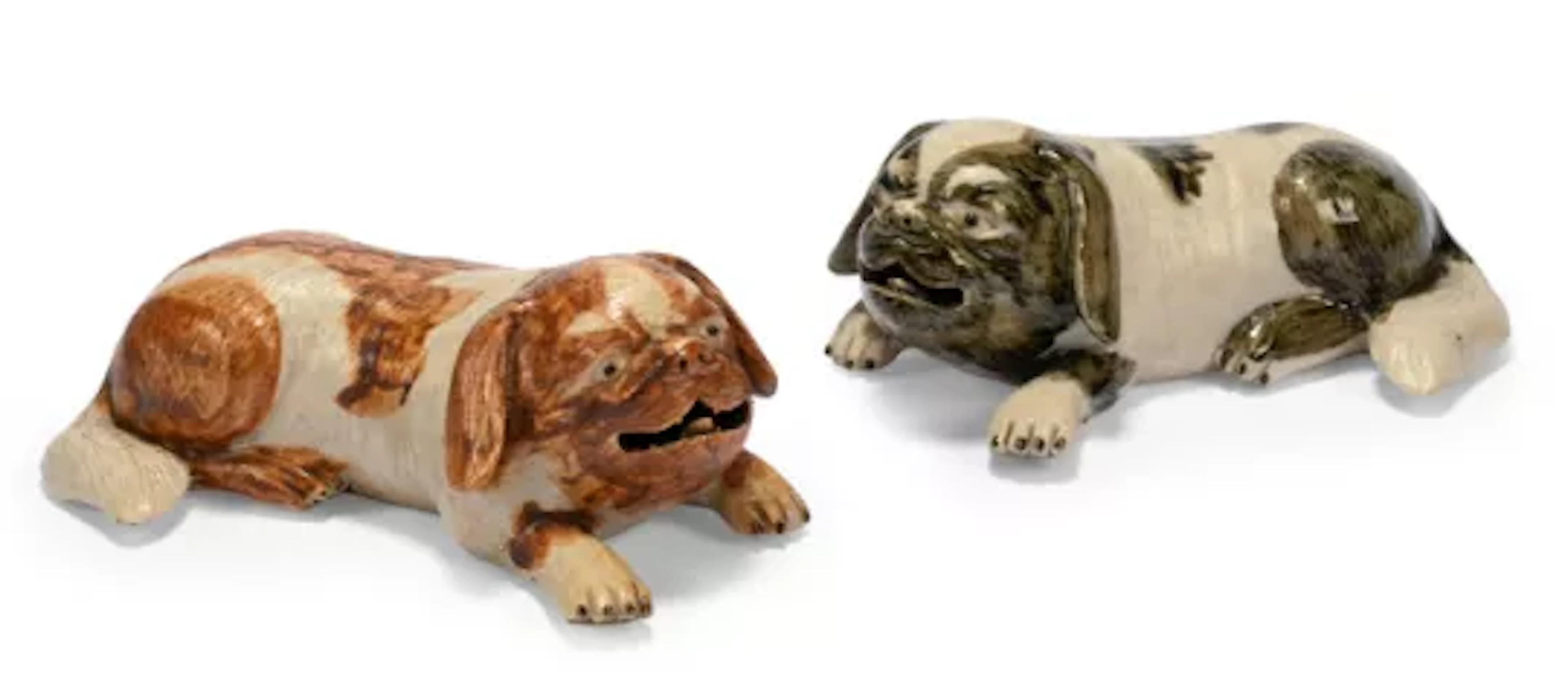 A pair of Chinese export models of recumbent dogs, Qing dynasty, 19th century