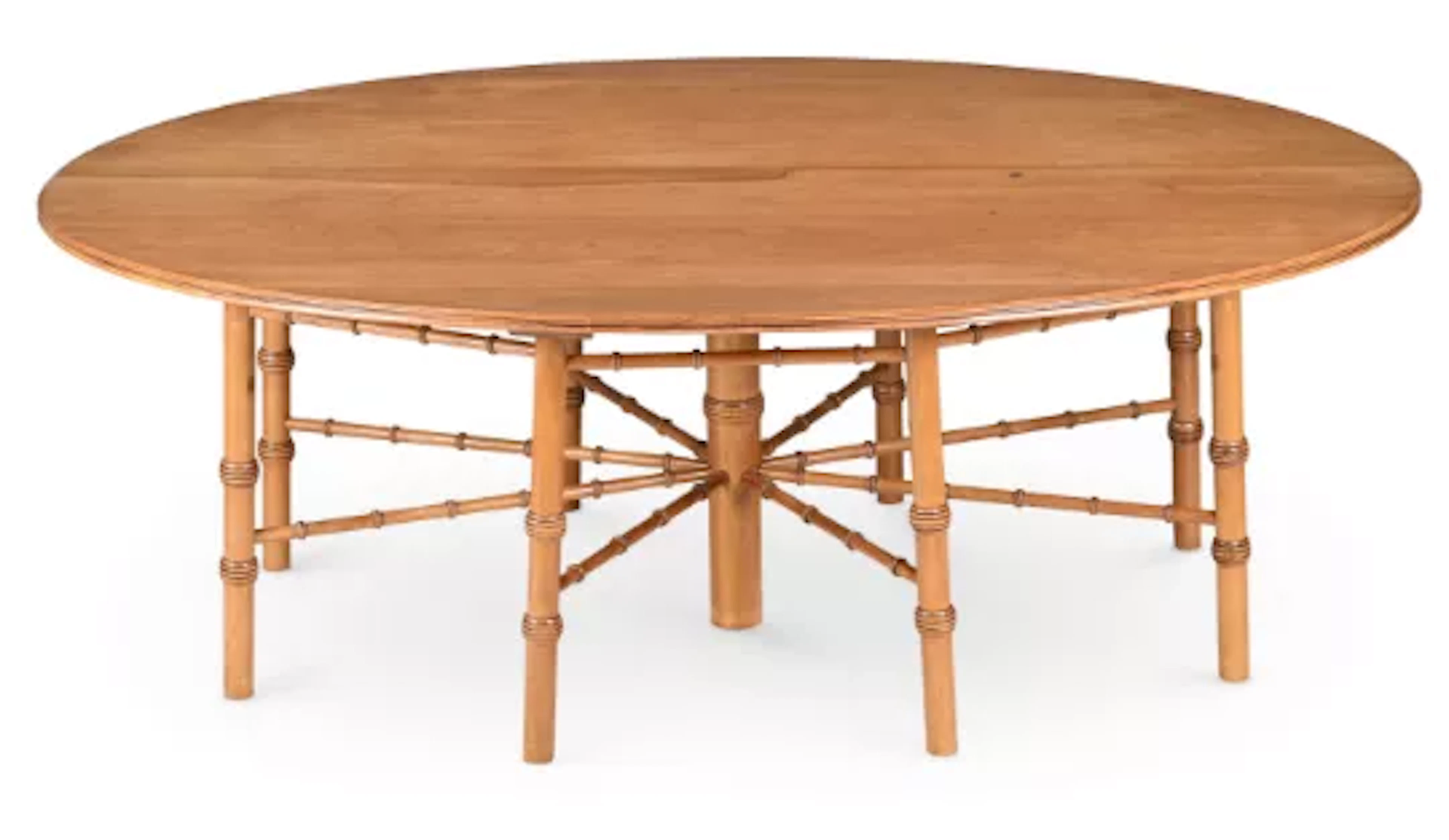 A WALNUT OVAL DINING TABLE, IN THE MANNER OF PHILIP WEBB, SUPPLIED