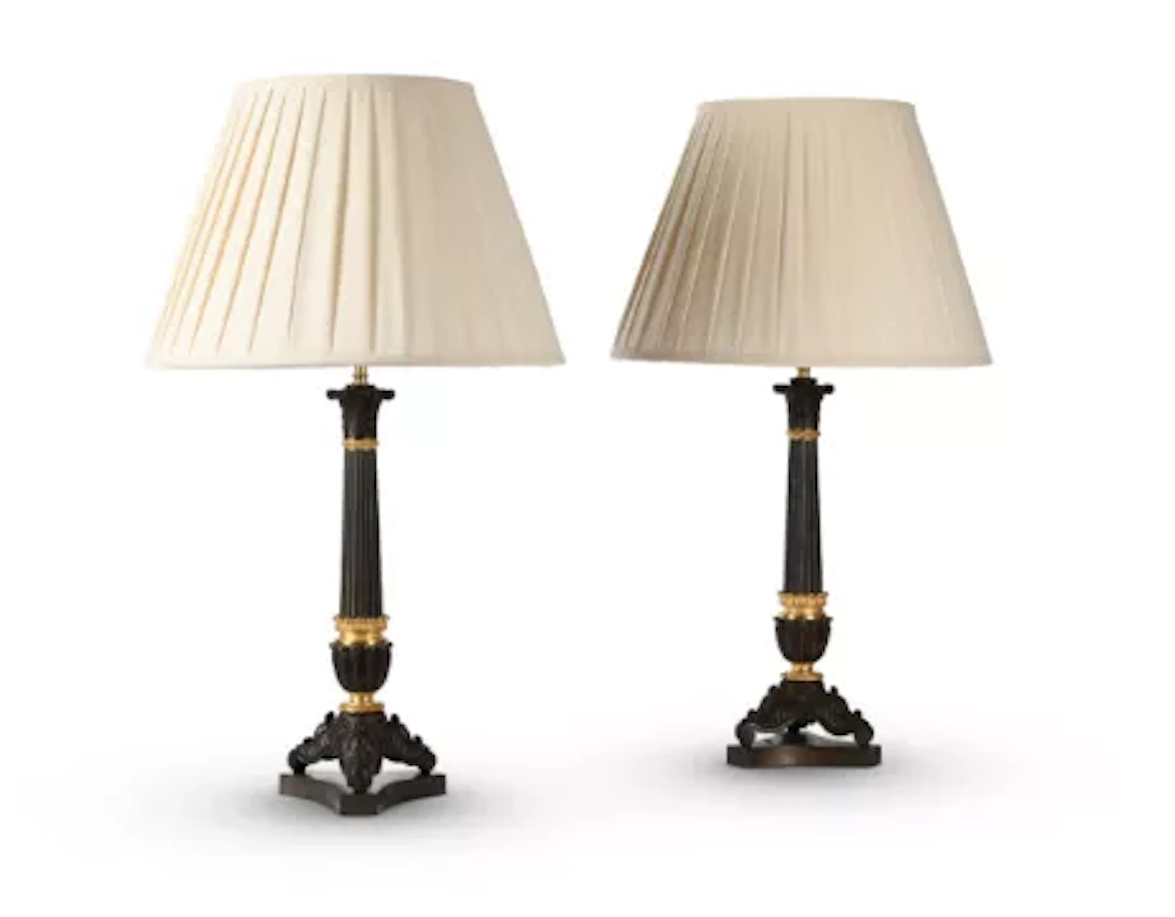 A PAIR OF FRENCH GILT AND PATINATED BRONZE 'HERCULANEUM' CANDLESTICK