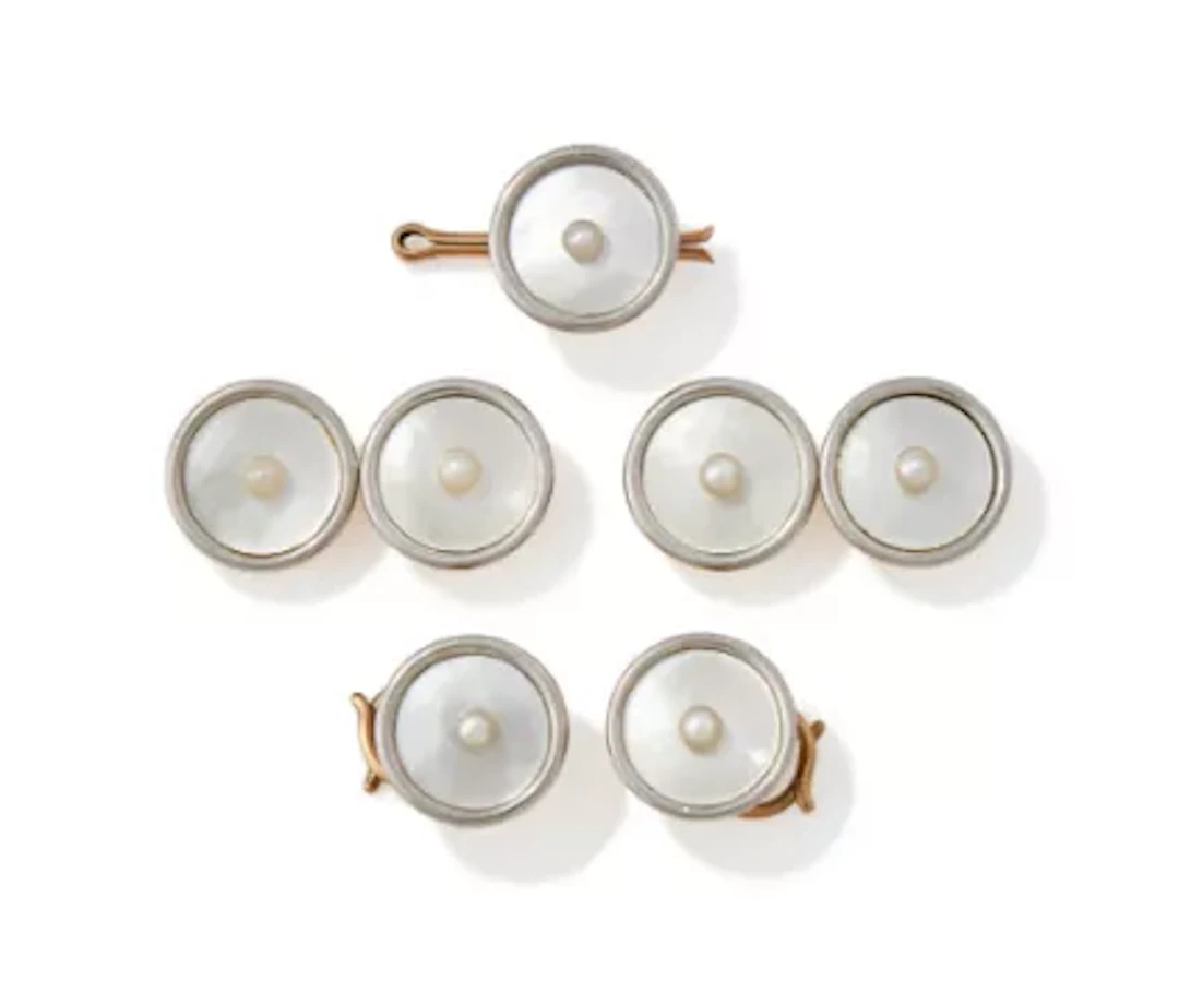CARTIER, AN EARLY 20TH CENTURY MOTHER-OF-PEARL AND PEARL DRESS SET