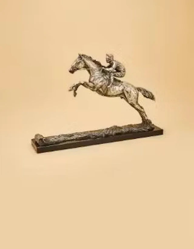 A LIMITED EDITION SILVER SCULPTURE OF THE RACEHORSE DESERT ORCHID