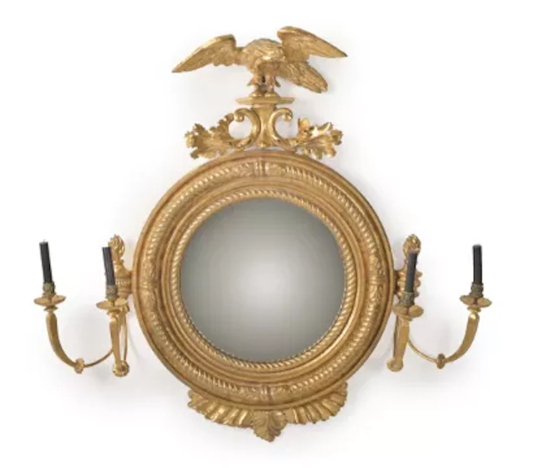 A REGENCY GILTWOOD CONVEX GIRANDOLE MIRROR, IN THE MANNER OF THOMAS