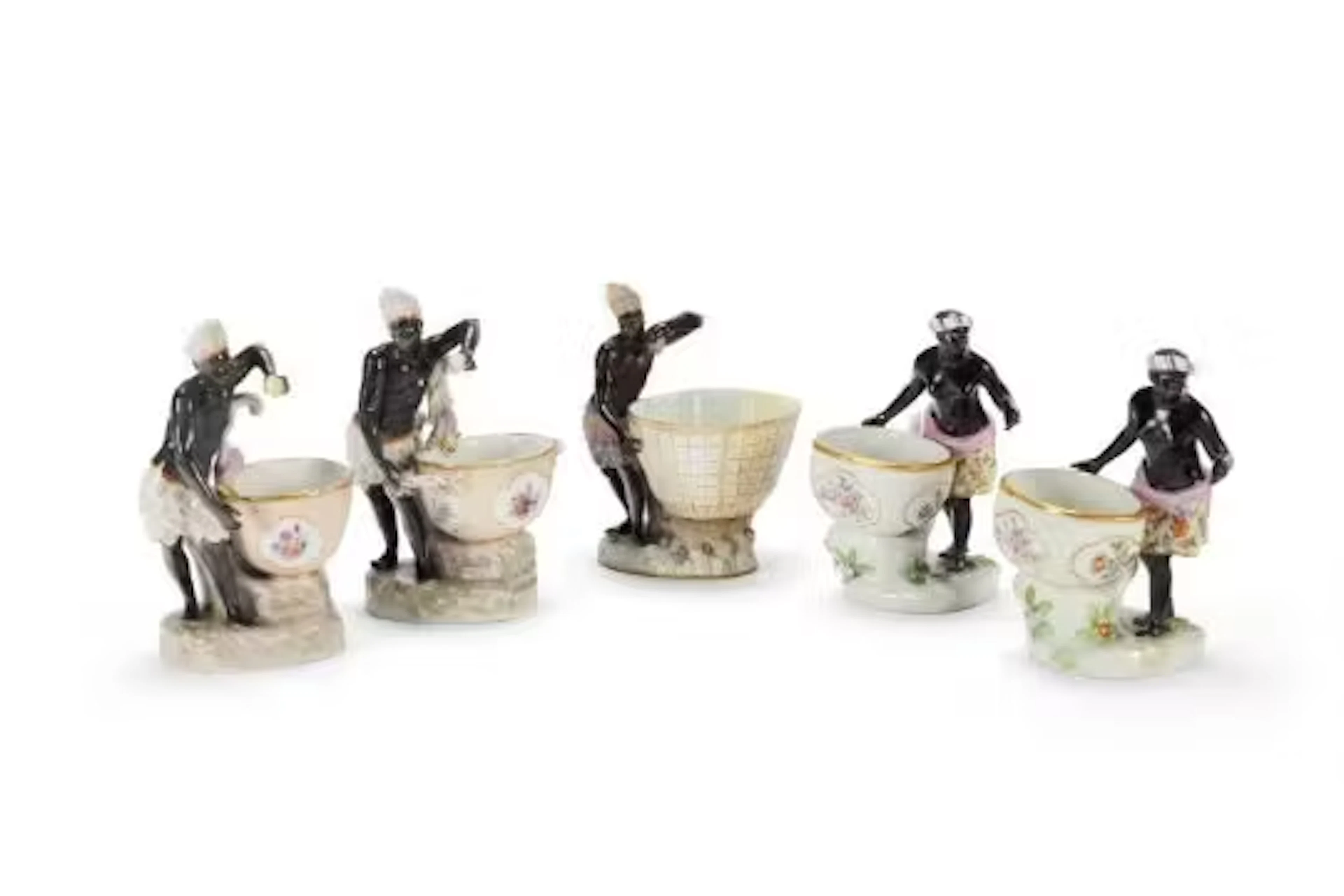 A MEISSEN FIGURAL SWEETMEAT EMBLEMATIC OF AFRICA FROM A SERIES OF