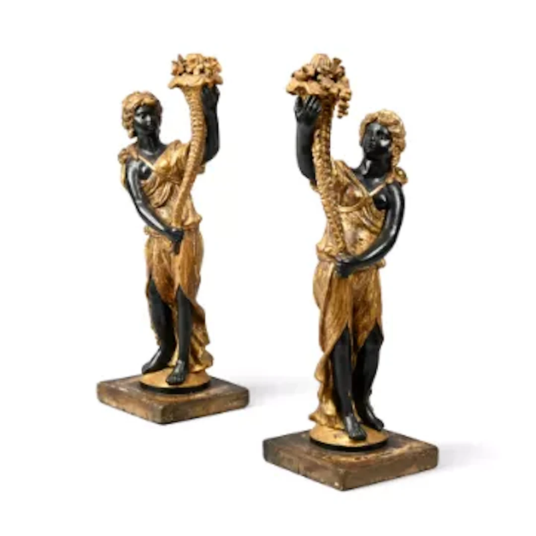 A PAIR OF CARVED GILTWOOD AND EBONISED FIGURAL TABLE LIGHTS, ITALIAN