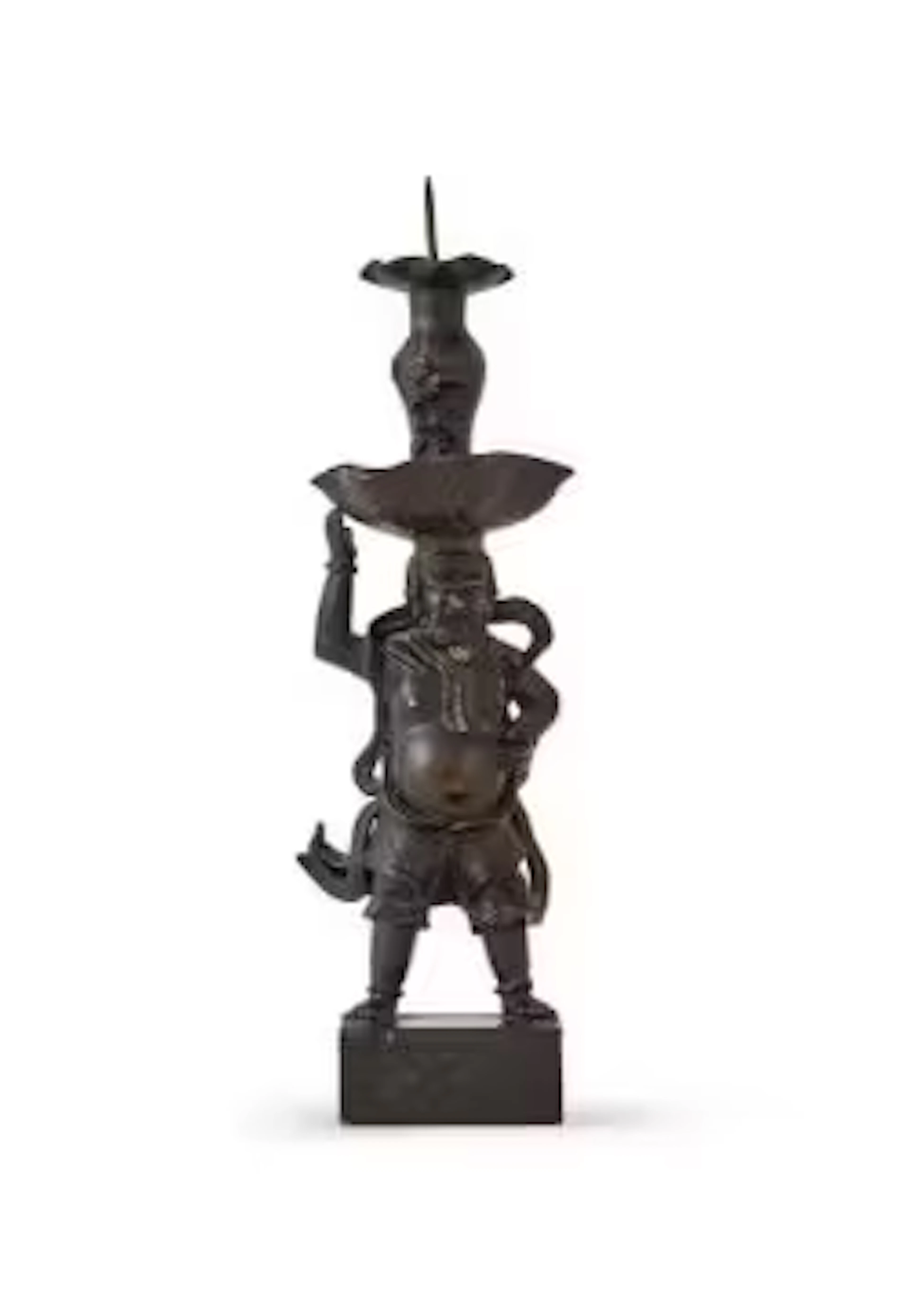 A Chinese signed bronze 'Foreigner' candlestick