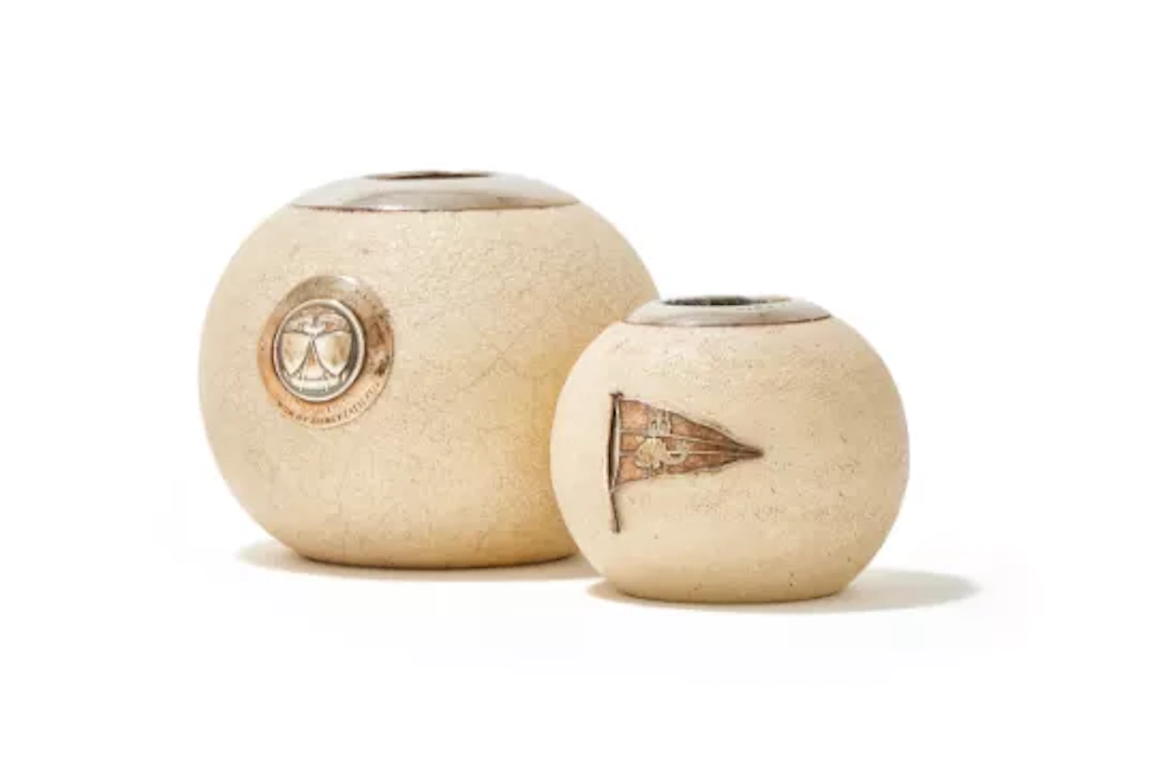 TWO POTTERY AND SILVER MOUNTED MATCH STRIKERS
