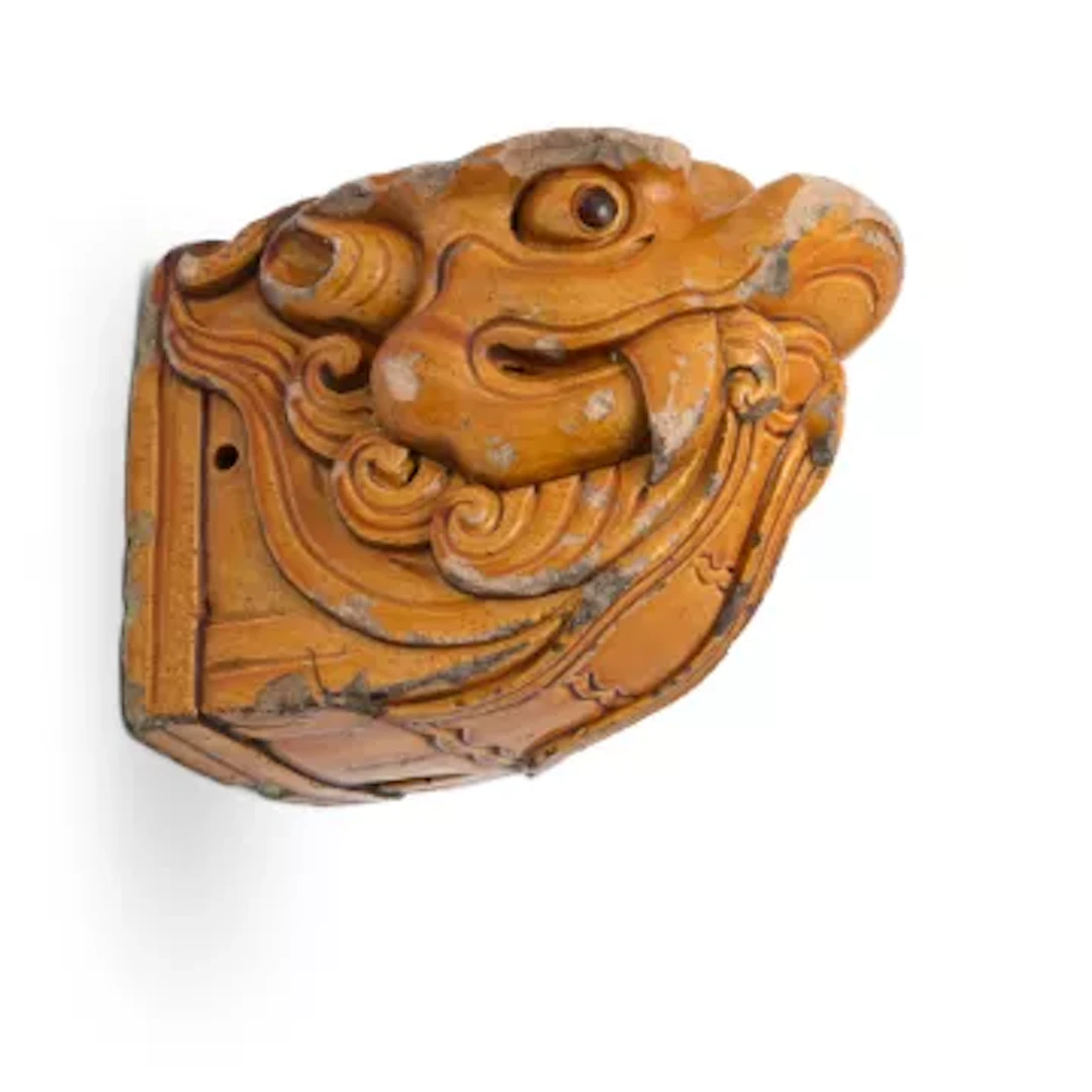 A Chinese yellow glazed ridge tile, 17th century