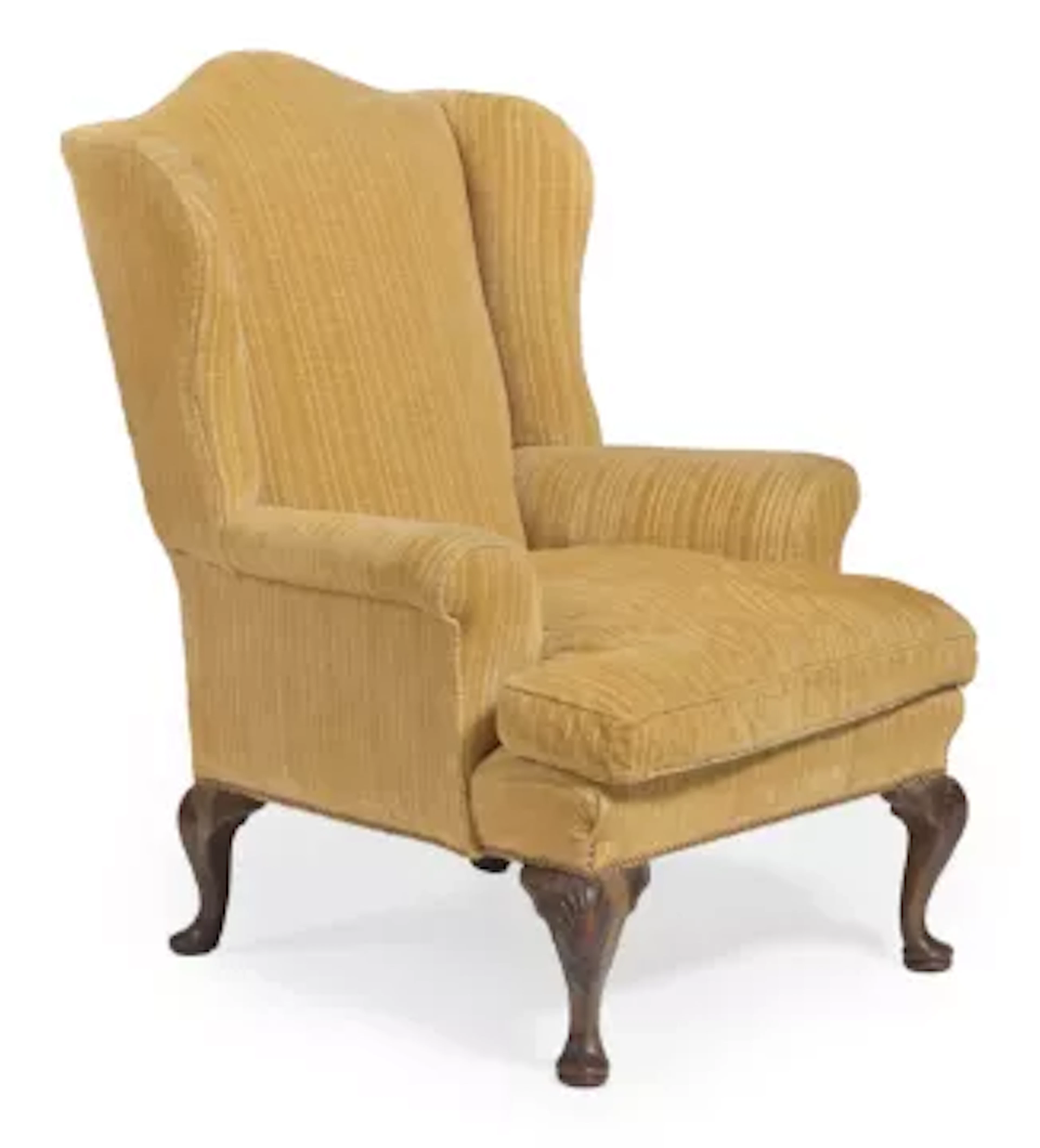 A CARVED WALNUT AND UPHOLSTERED WING ARMCHAIR, IN THE GEORGE II STYLE