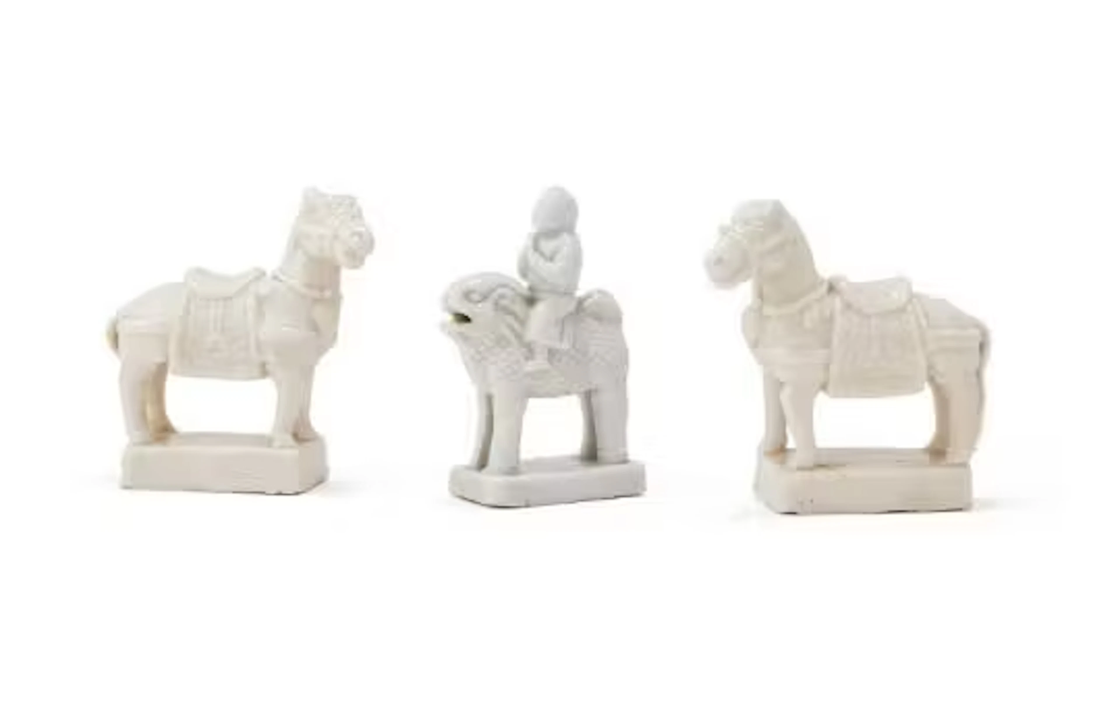A fine pair of Chinese porcelain Dehua models of standing horses