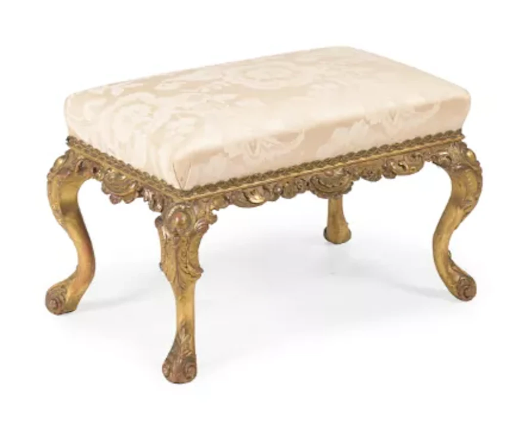 A GEORGE IV CARVED GILTWOOD STOOL, CIRCA 1830