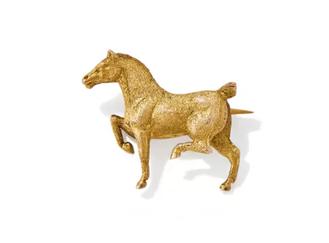 AN EARLY 20TH CENTURY HORSE BROOCH