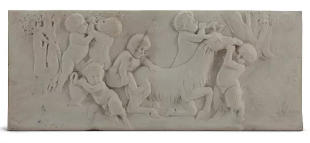 AFTER FRANÇOIS DUQUESNOY, A CARVED MARBLE CHIMNEYPIECE TABLET OF BACCHANALIAN