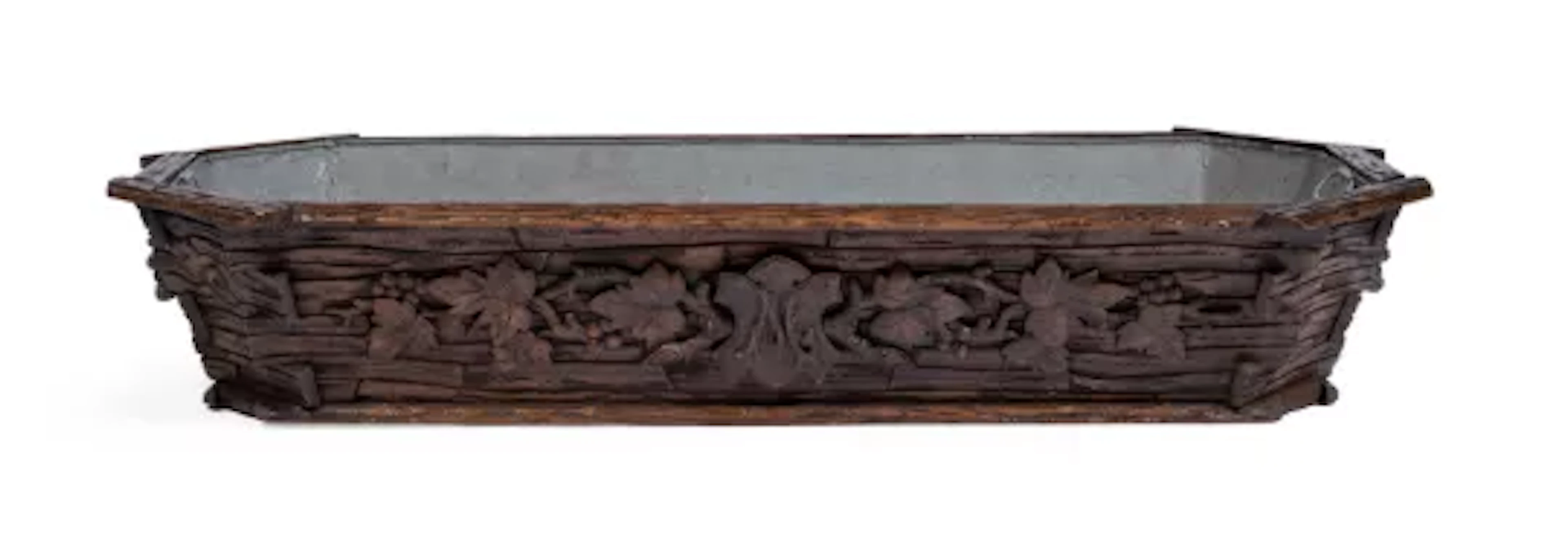 A BLACK FOREST LINDEN WOOD WINE COOLER OR JARDINIERE, LATE 19TH CENTURY
